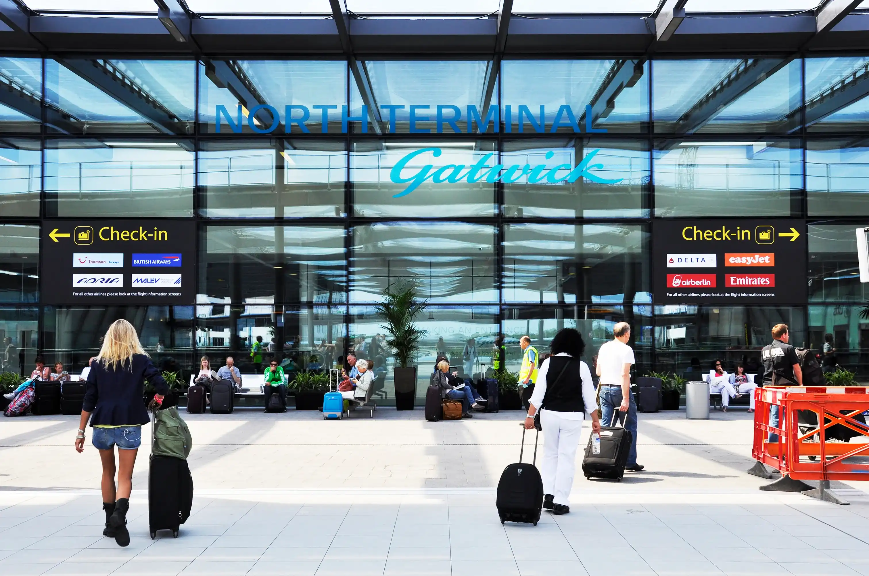 CRAWLEY, UK - CIRCA AUGUST 2011: Gatwick Airport North Terminal. Gatwick is the second busiest airport in UK after Heathrow Airport. CRAWLEY, UK - CIRCA AUGUST 2011: Gatwick Airport North Terminal. Gatwick is the second busiest airport in UK after Heathrow Airport.