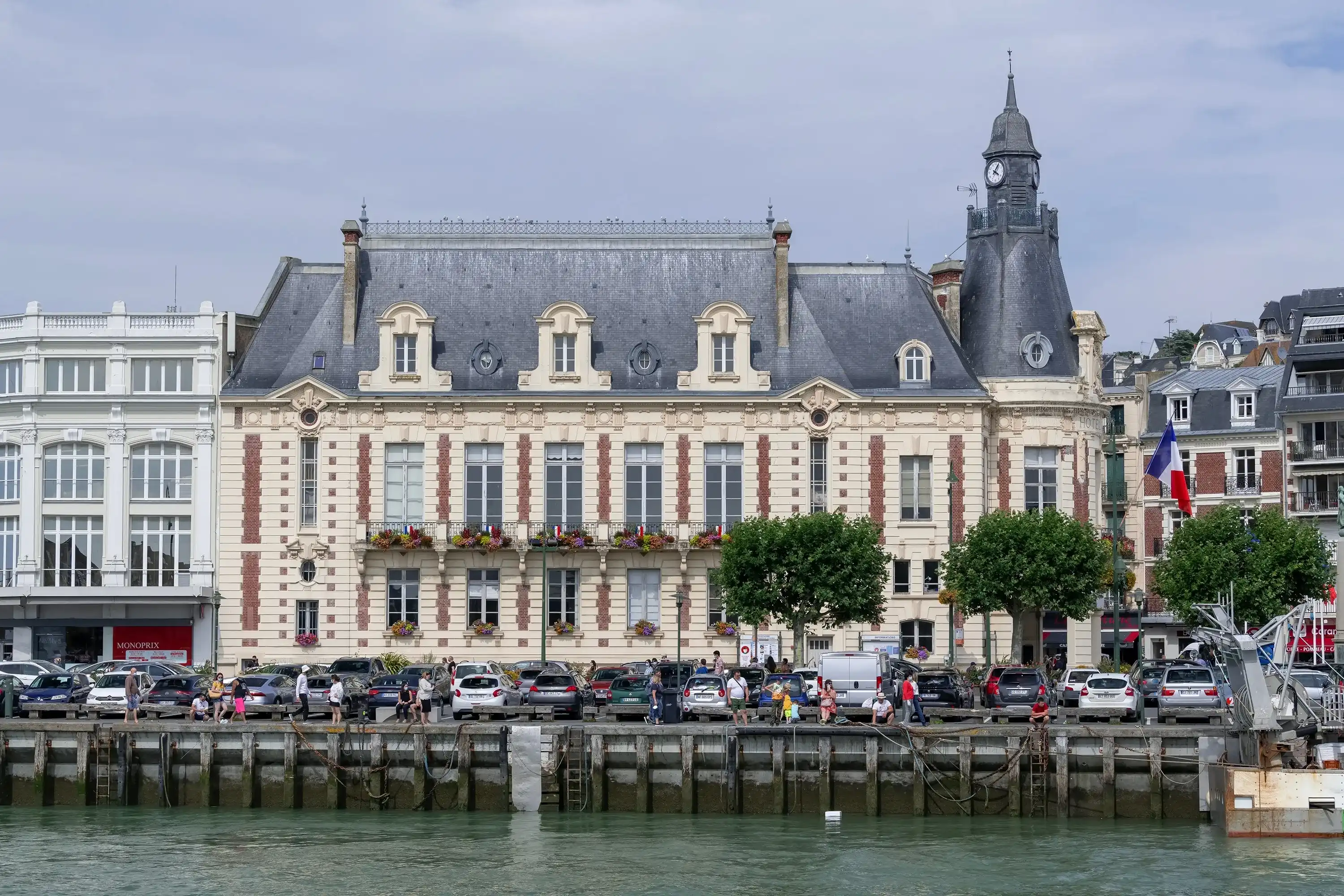 Trouville-sur-Mer, France - August 11th 2021 : Focus on the City Hall of Trouville build between 1911 and 1913 by Laurent Farge and Paul Farge. Trouville-sur-Mer, France - August 11th 2021 : Focus on the City Hall of Trouville build between 1911 and 1913 by Laurent Farge and Paul Farge.
