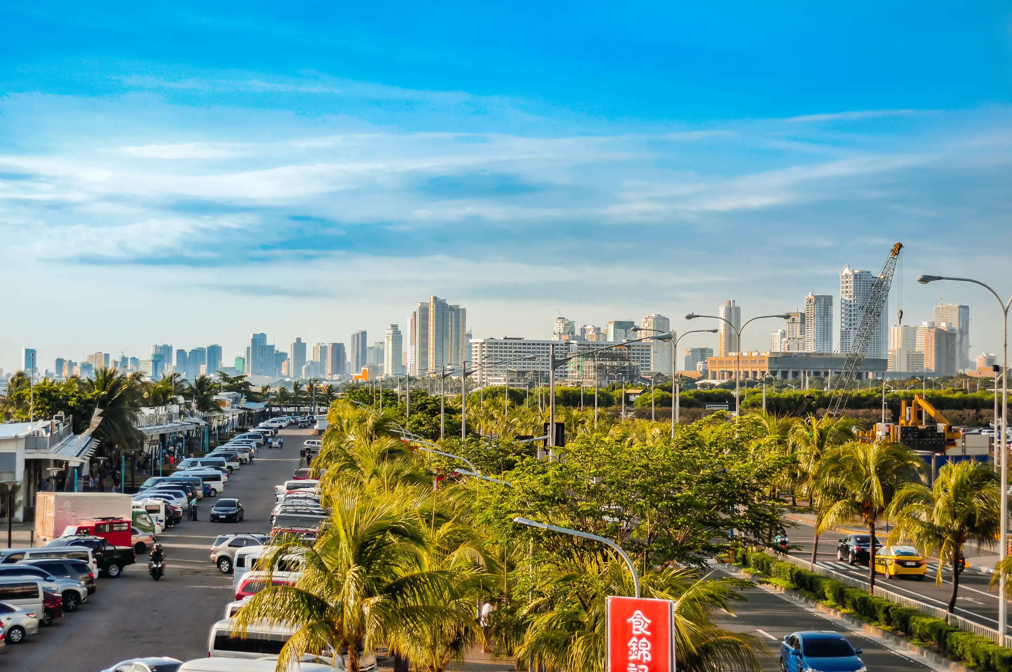 Manila, Philippines - July 3, 2019 - Skyline of Metro Manila, View from SM Mall of Asia, by the bay, Manila Bay Manila, Philippines - July 3, 2019 - Skyline of Metro Manila, View from SM Mall of Asia, by the bay, Manila Bay