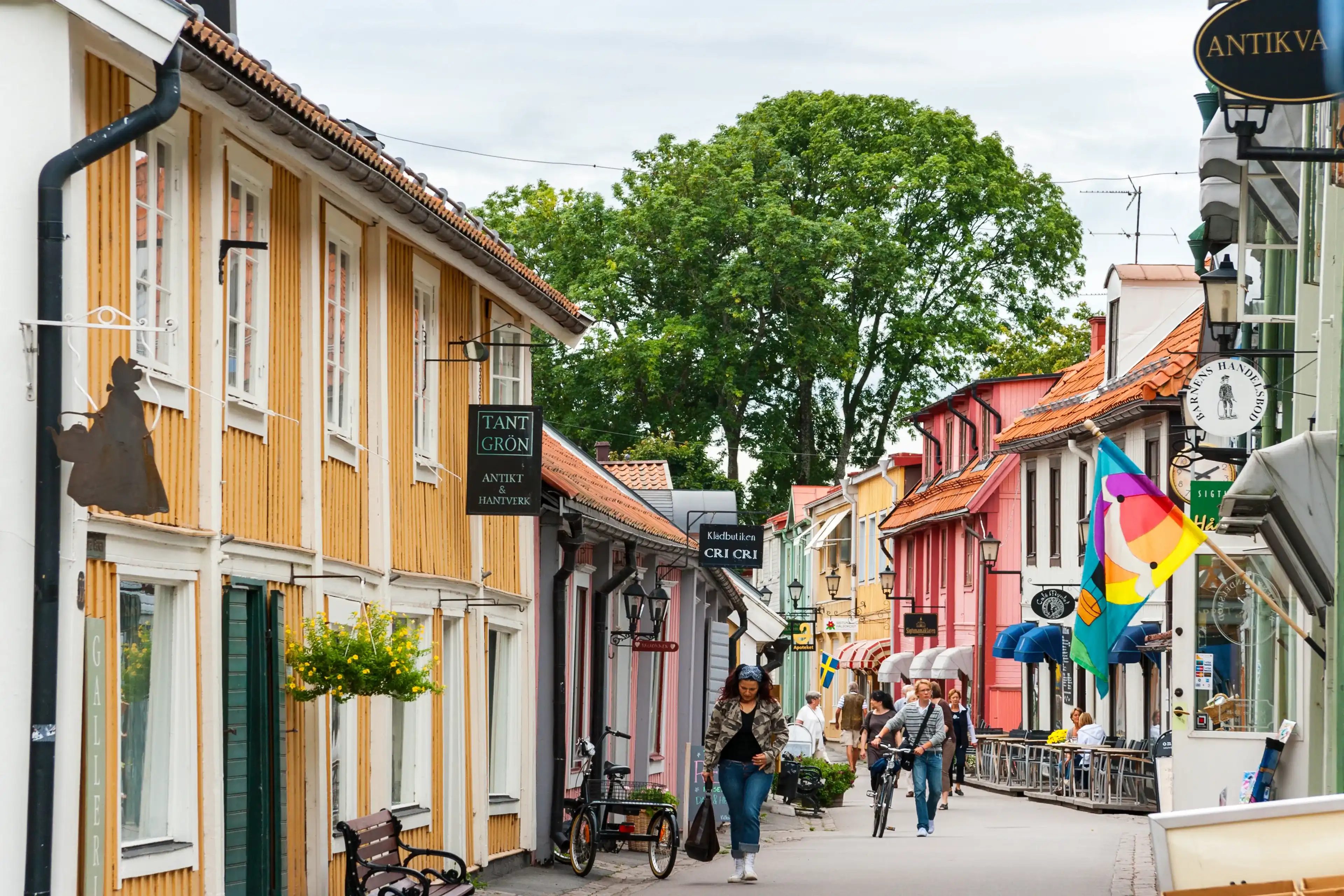 SIGTUNA, SWEDEN - AUGUST 26, 2008: Traditional wooden houses on Stora Gatan street in heart of old town SIGTUNA, SWEDEN - AUGUST 26, 2008: Traditional wooden houses on Stora Gatan street in heart of old town