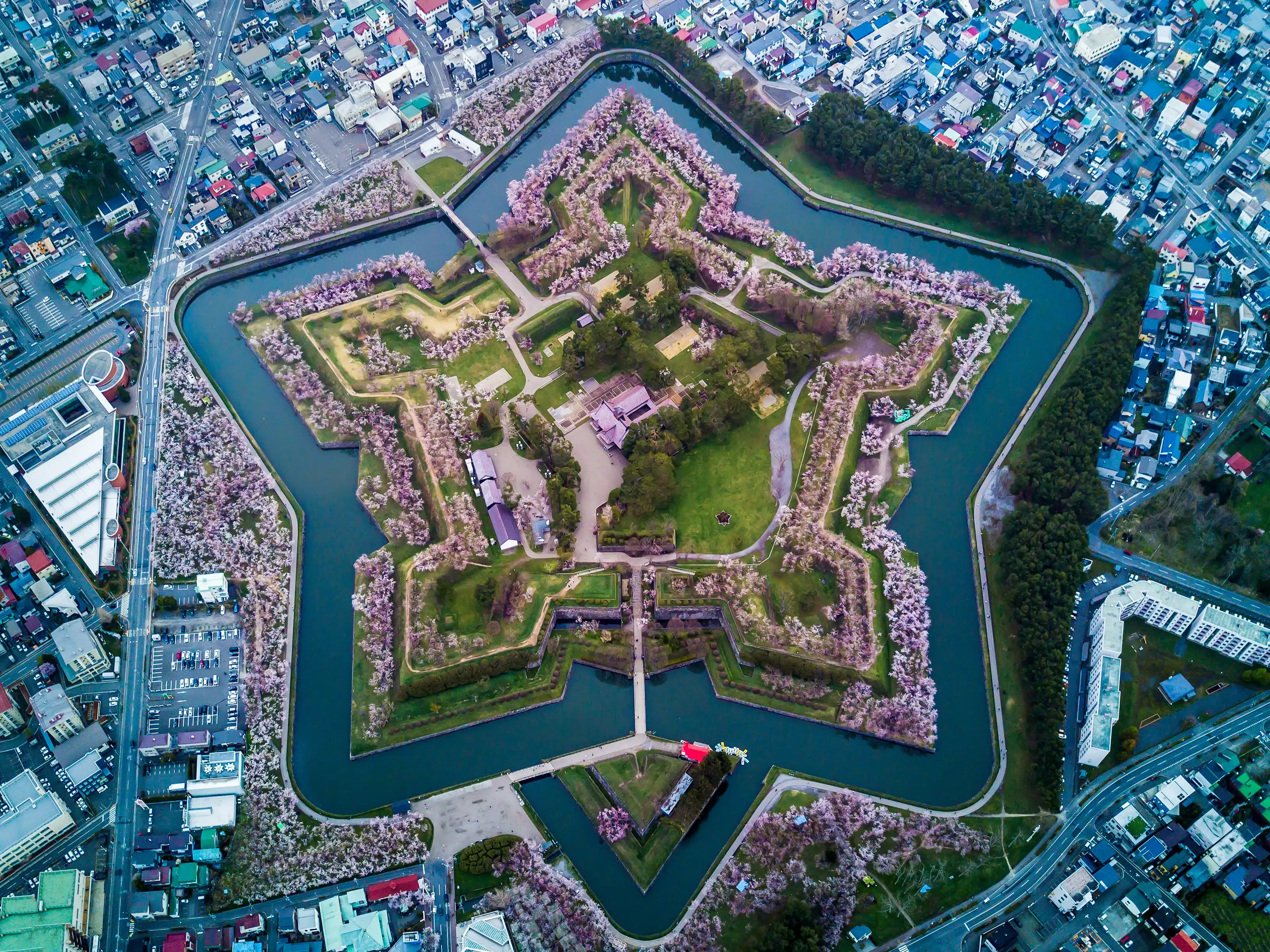 Aerial Top view of Fort Goryokaku with cherry blossom, Build for protect city from enemy in Star Shape. This place is a famous to visit in Hakodate, Hokkaido Japan Aerial Top view of Fort Goryokaku with cherry blossom, Build for protect city from enemy in Star Shape. This place is a famous to visit in Hakodate, Hokkaido Japan