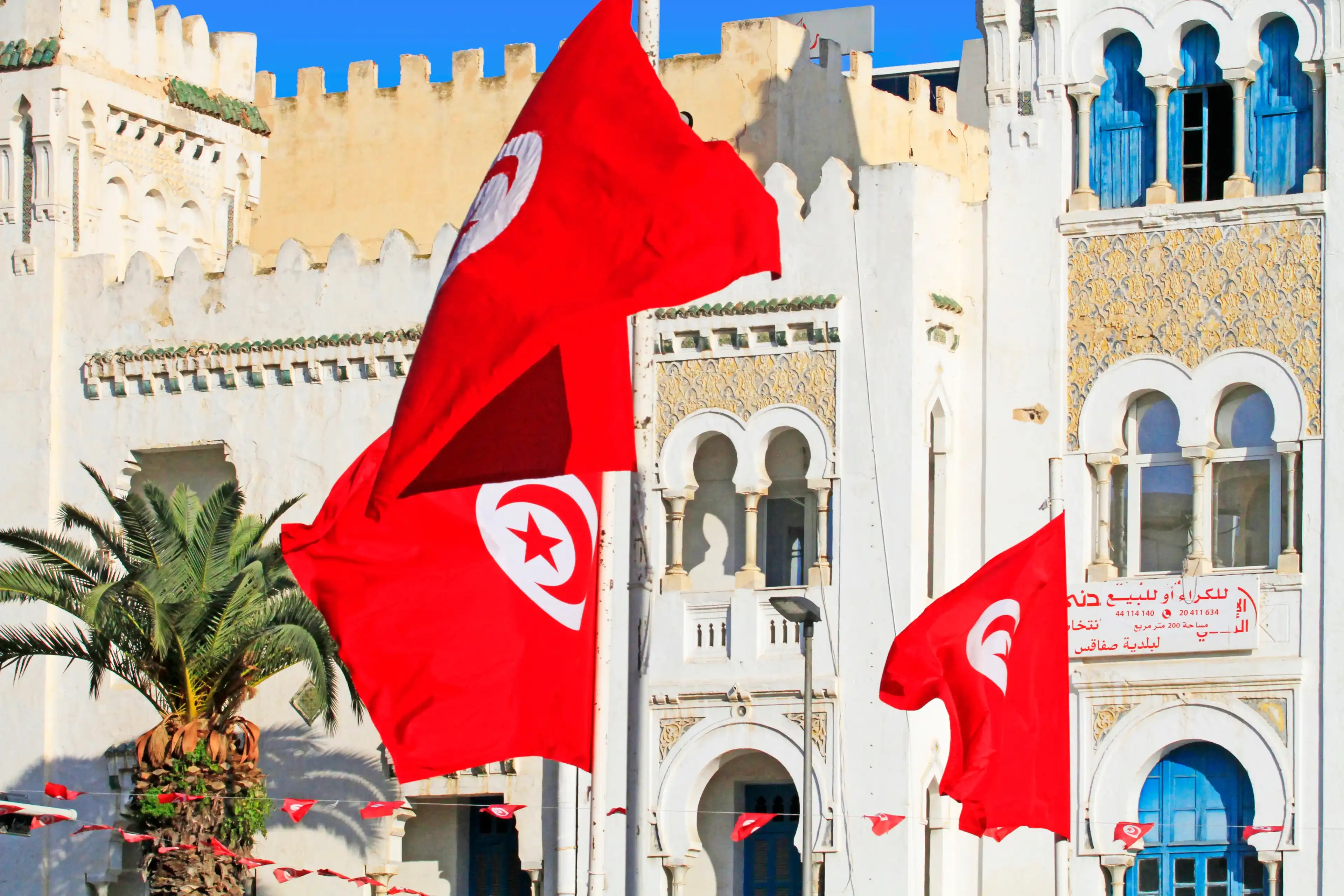 City of Sfax, Sfax Governorate / Tunisia - around March 2019 : Tunisian flags in a square of Sfax, Tunisia City of Sfax, Sfax Governorate / Tunisia - around March 2019 : Tunisian flags in a square of Sfax, Tunisia
