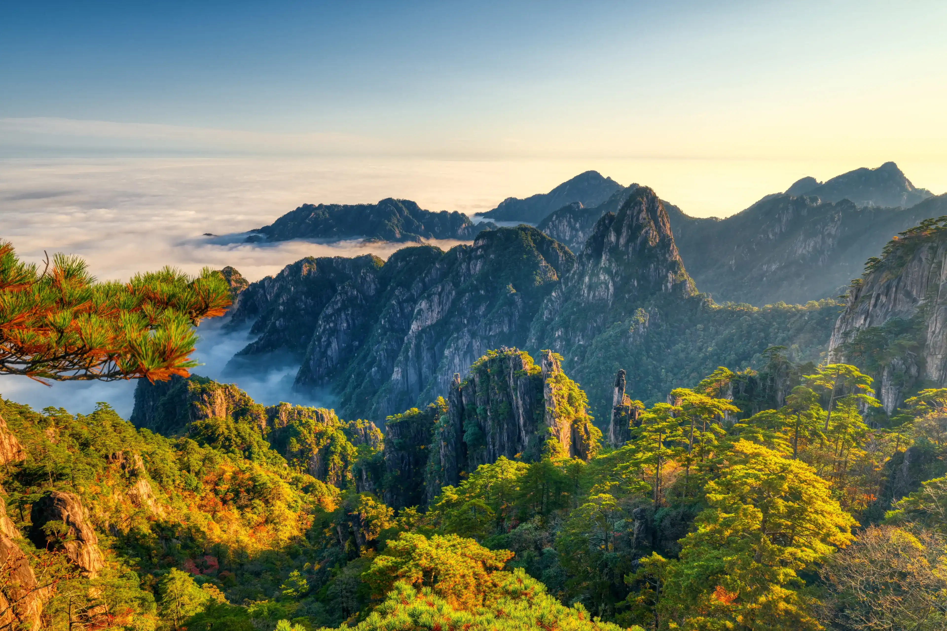 Sea of clouds under the sunset, at Huangshan Mountain. Sea of clouds under the sunset, at Huangshan Mountain.