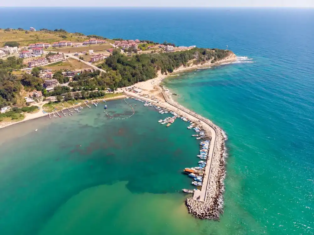Aerial photo of the beautiful small town and seaside resort of Obzor in Bulgaria showing the fishing and marina side of the town showing fishing boats and the small sunny beach Aerial photo of the beautiful small town and seaside resort of Obzor in Bulgaria showing the fishing and marina side of the town showing fishing boats and the small sunny beach