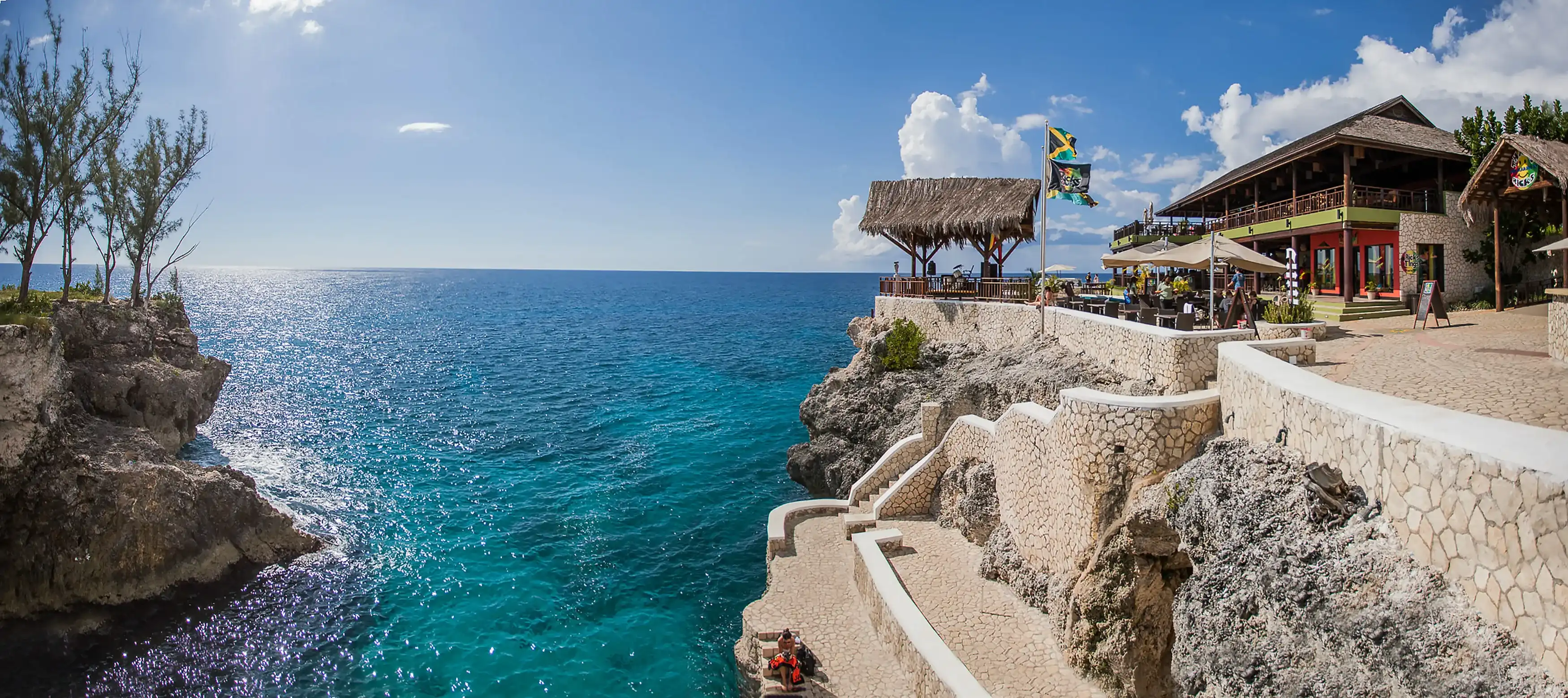 Negril, Jamaica - 11/25/2013: Famous Ricks restaurant in Negril Jamaica cliff jumping attraction day Negril, Jamaica - 11/25/2013: Famous Ricks restaurant in Negril Jamaica cliff jumping attraction day