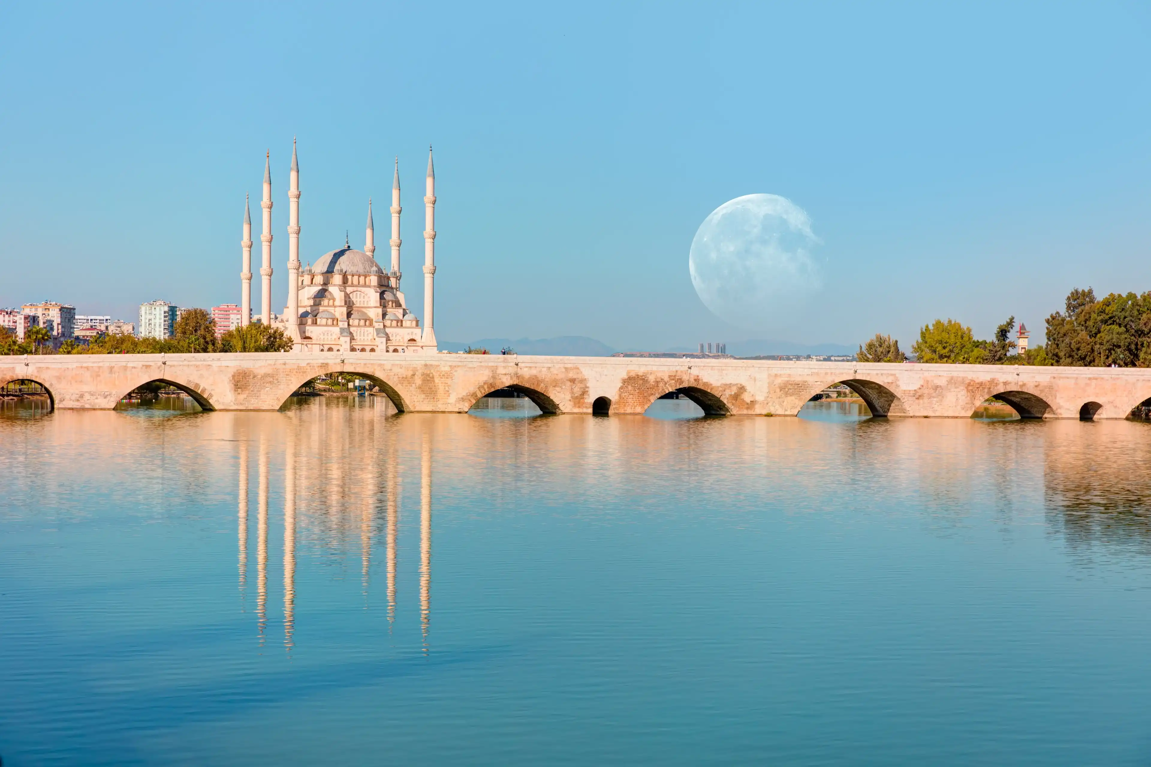 The Stone Bridge and Sabanci Mosque with full moon - Adana, Turkey "Elements of this image furnished by NASA The Stone Bridge and Sabanci Mosque with full moon - Adana, Turkey "Elements of this image furnished by NASA