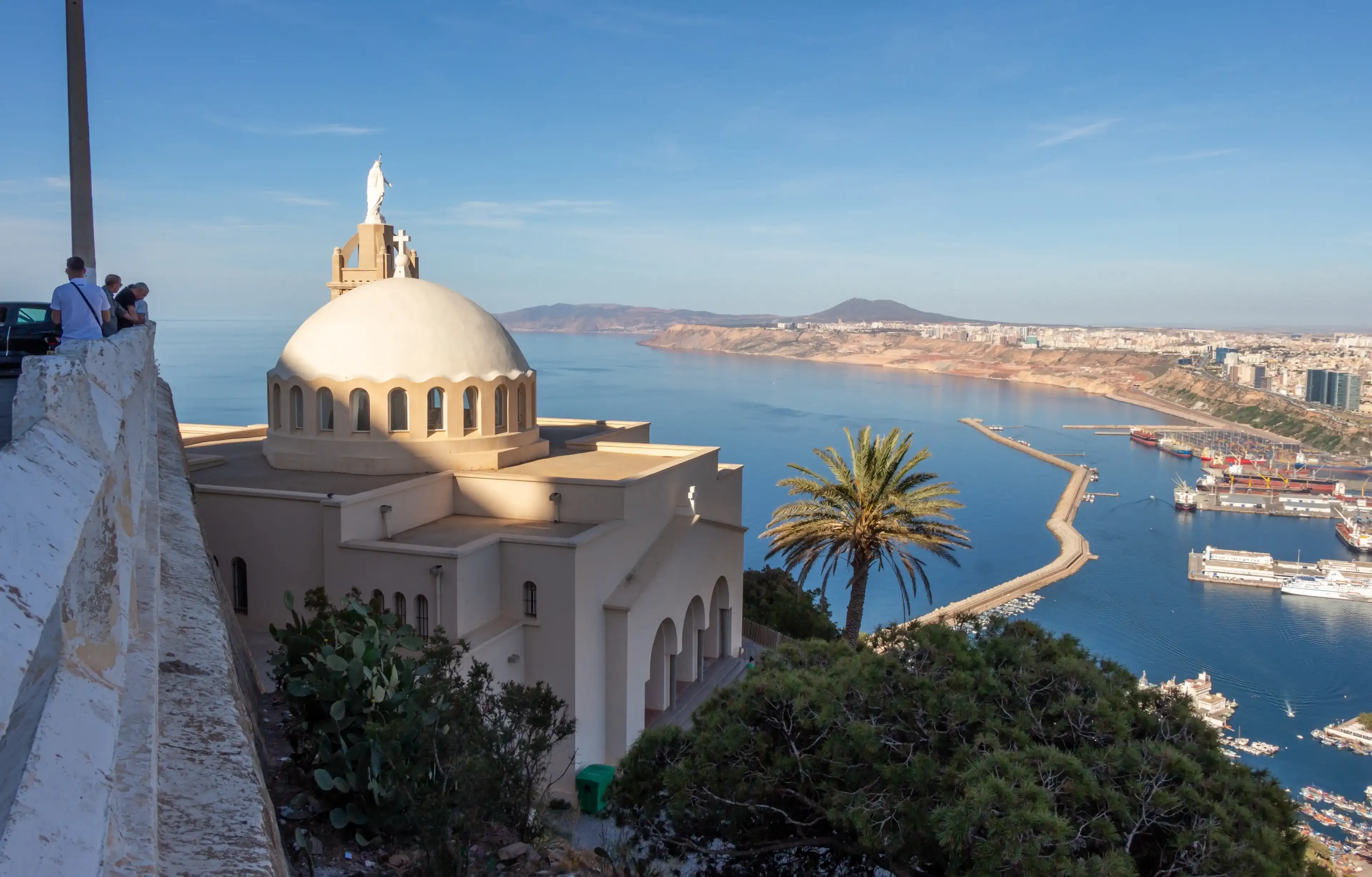 Panoramic view of Oran, Algeria, with the Santa Cruz chapel in the foreground. People looking at the city. Panoramic view of Oran, Algeria, with the Santa Cruz chapel in the foreground. People looking at the city.