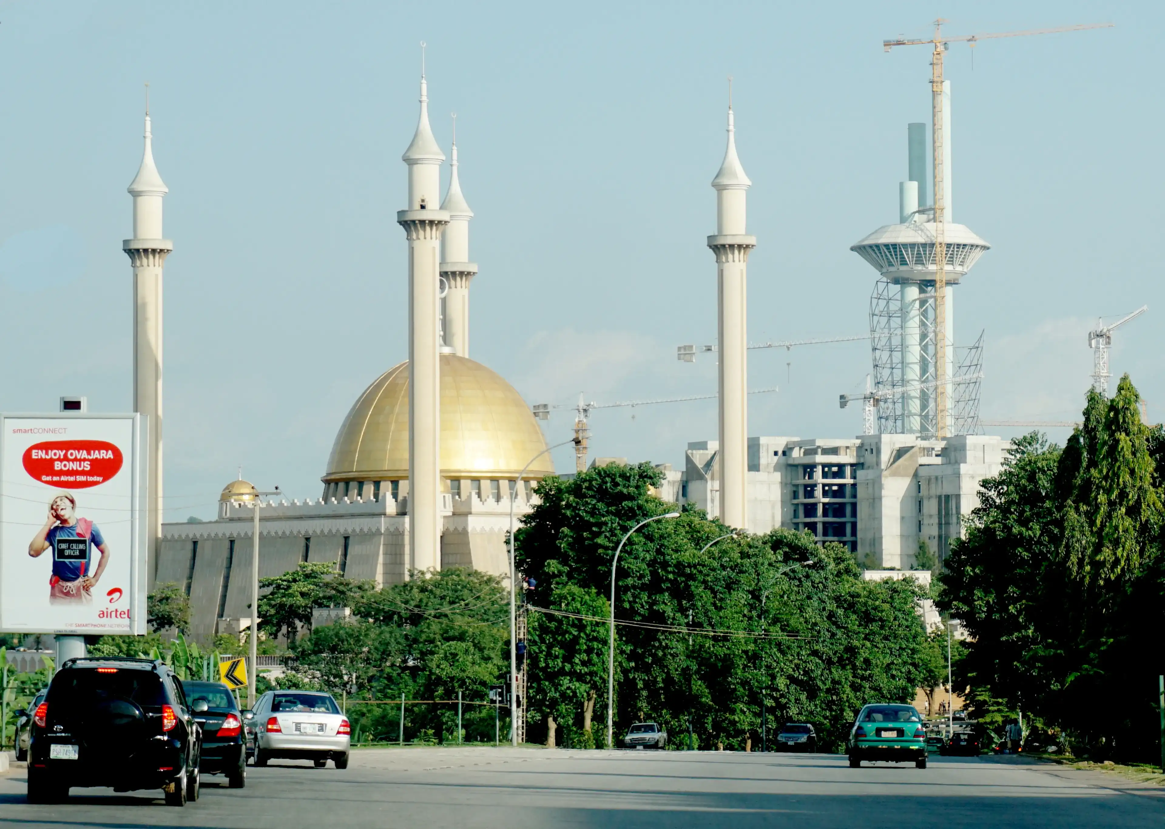Abuja, FCT/Nigeria - May 13th, 2018: Picture focus on the Abuja National mosque in Abuja, Nigeria. It has 4 minarets and muslims pray 5 times a day. Islam is one of the main religion in Nigeria. Abuja, FCT/Nigeria - May 13th, 2018: Picture focus on the Abuja National mosque in Abuja, Nigeria. It has 4 minarets and muslims pray 5 times a day. Islam is one of the main religion in Nigeria.