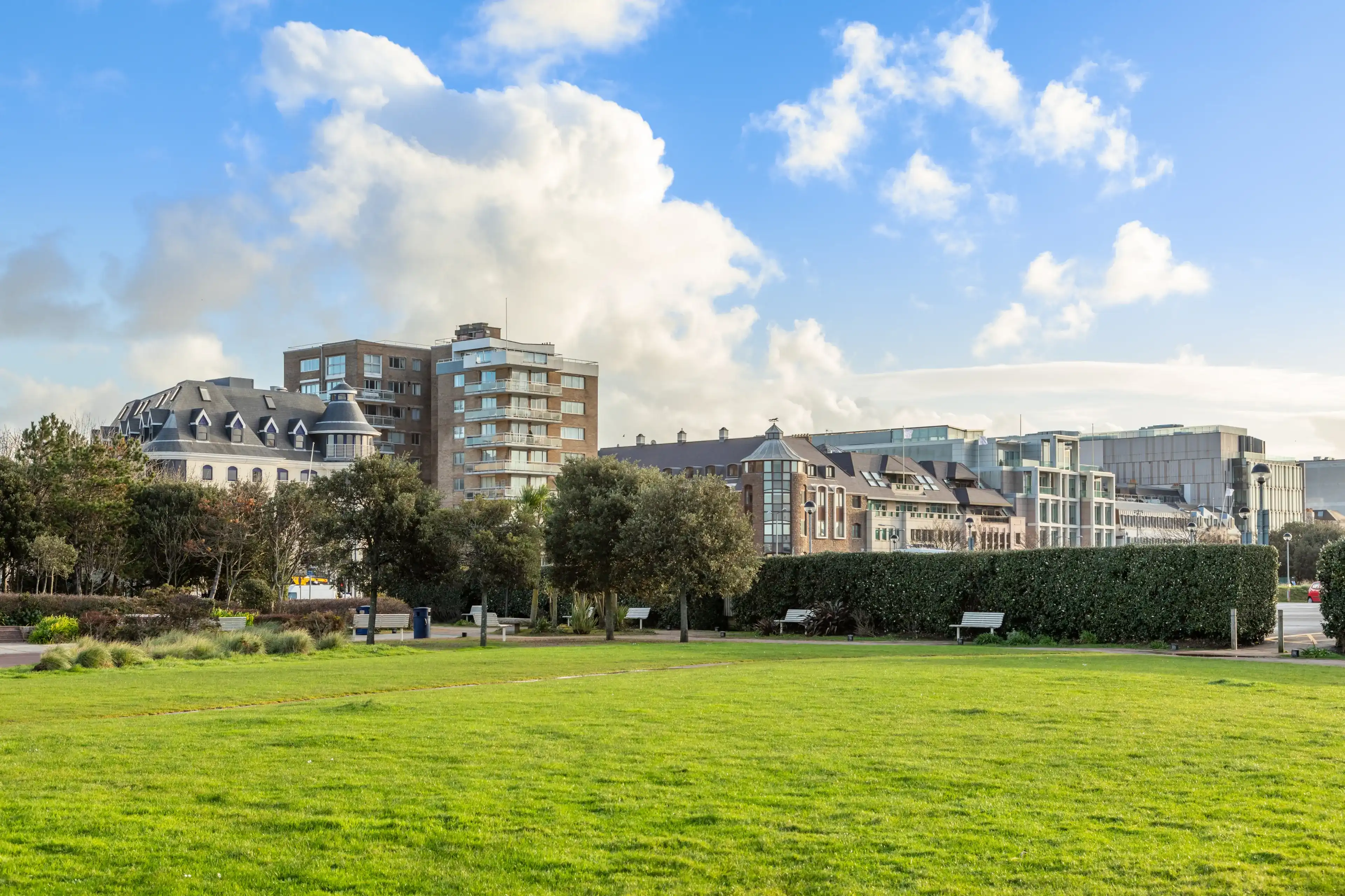 Saint Helier seaside park with office buildings in the foreground, bailiwick of Jersey, Channel Islands Saint Helier seaside park with office buildings in the foreground, bailiwick of Jersey, Channel Islands