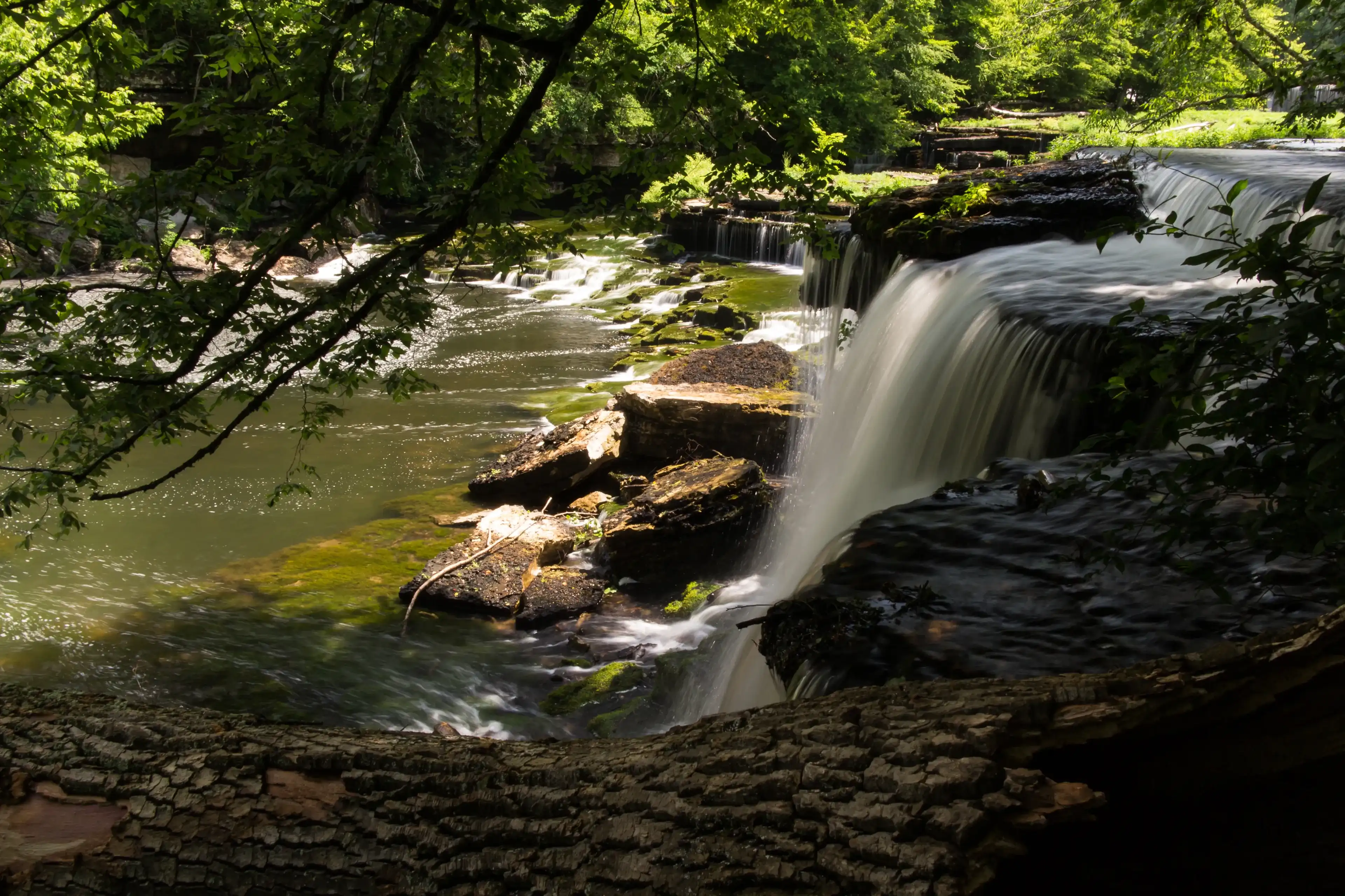 A waterfall in a forest. Old Stone Fort State Archaeological Park, Manchester, TN, USA. A waterfall in a forest. Old Stone Fort State Archaeological Park, Manchester, TN, USA.