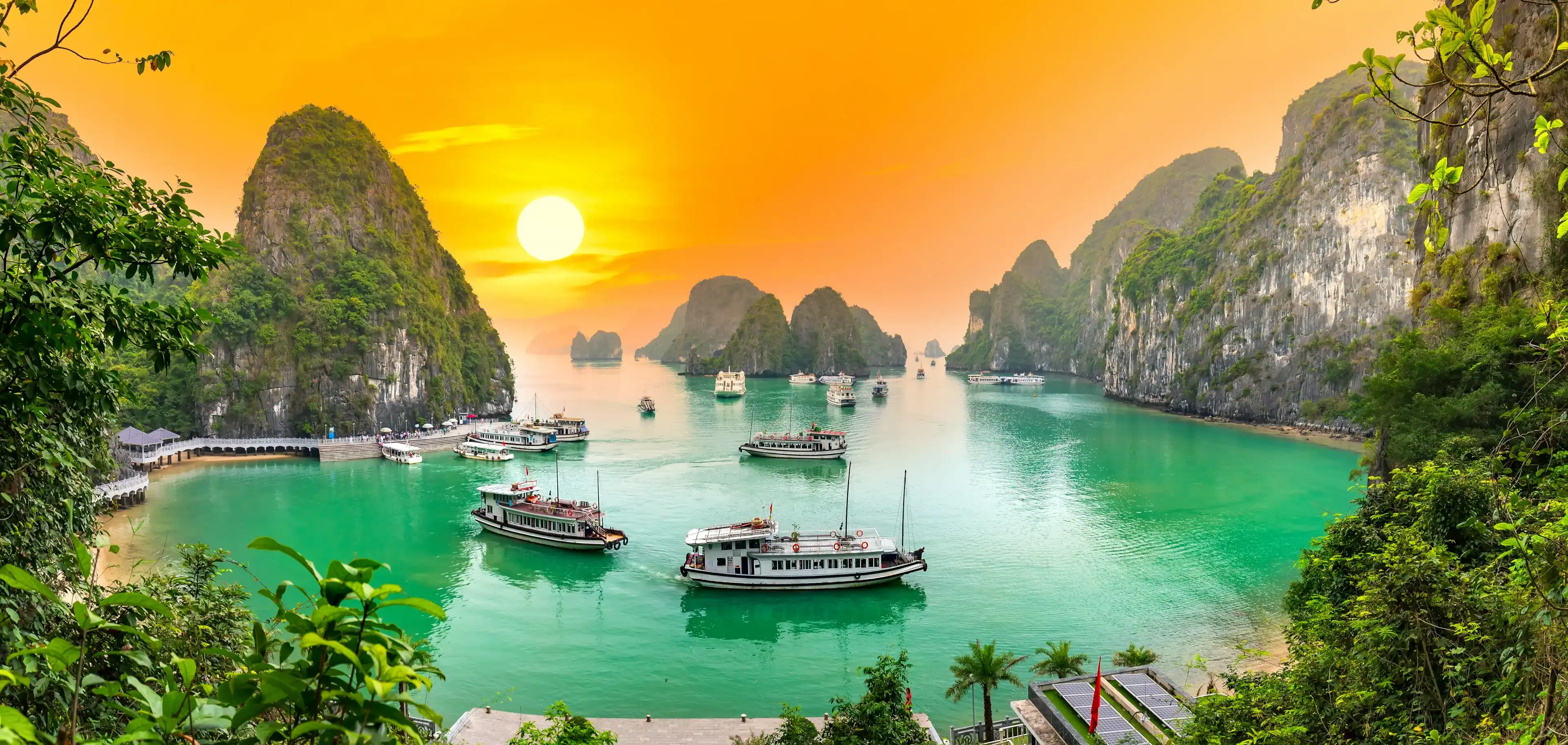 Dreamy sunset landscape Halong Bay, Vietnam view from adove. This is the UNESCO World Heritage Site, a beautiful natural wonder in northern Vietnam Dreamy sunset landscape Halong Bay, Vietnam view from adove. This is the UNESCO World Heritage Site, a beautiful natural wonder in northern Vietnam