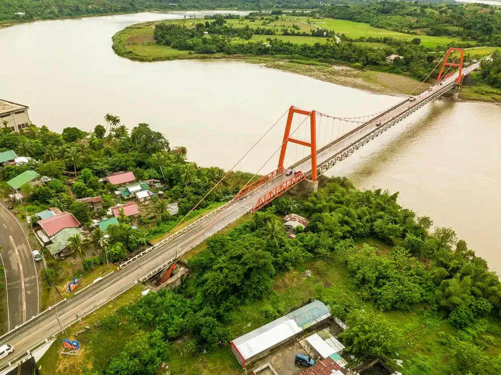 Magapit Suspension Bridge and Cagayan River, largest by volume and longest river in the Philippines. Magapit Suspension Bridge and Cagayan River, largest by volume and longest river in the Philippines.