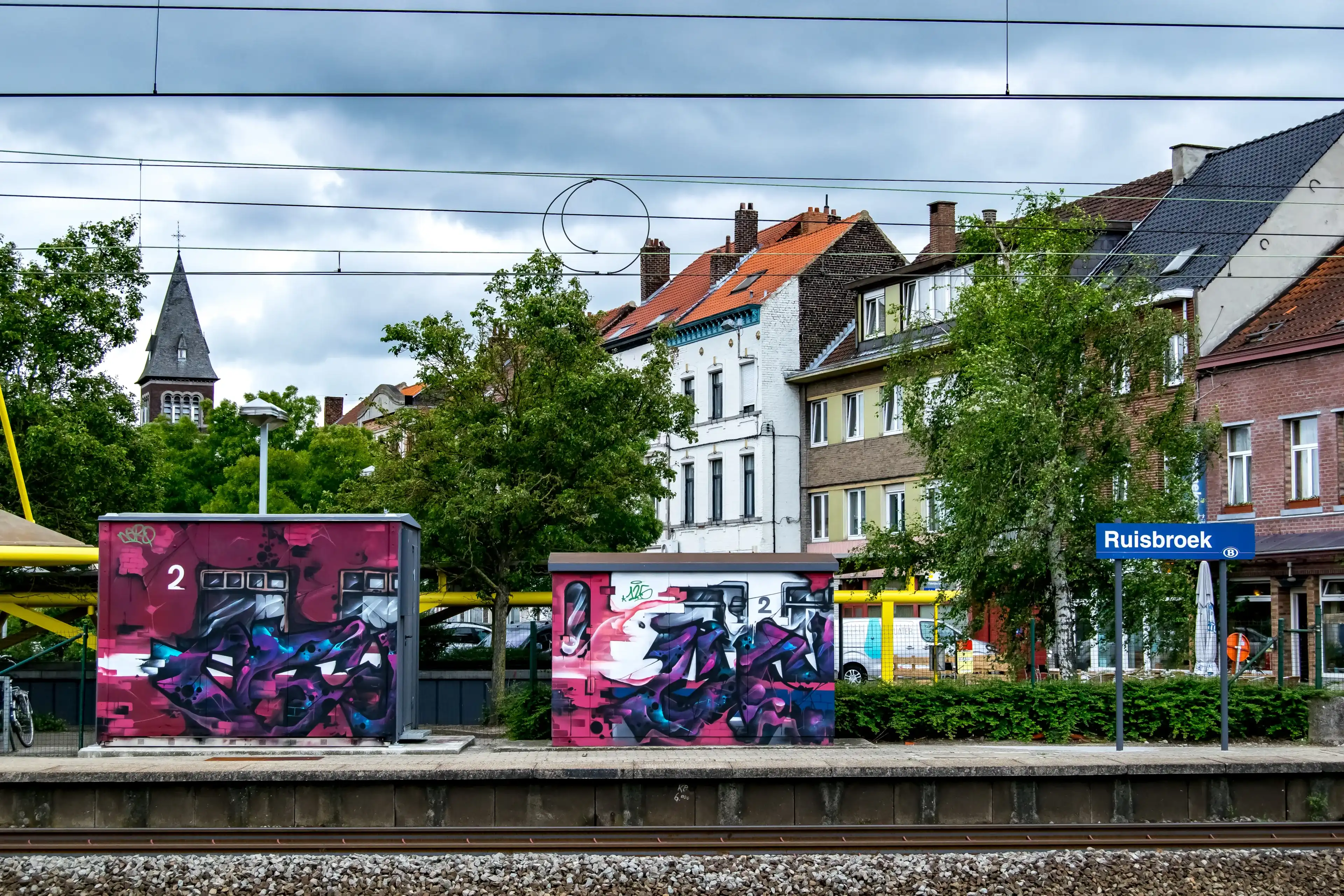 RUISBROEK, BELGIUM, JUNE 12, 2017: VEIWS FROM THE PASSENGER PLATFORM AT THE STATION IN RUISBROEK, BELGIUM ON JUNE 12, 2017 RUISBROEK, BELGIUM, JUNE 12, 2017: VEIWS FROM THE PASSENGER PLATFORM AT THE STATION IN RUISBROEK, BELGIUM ON JUNE 12, 2017