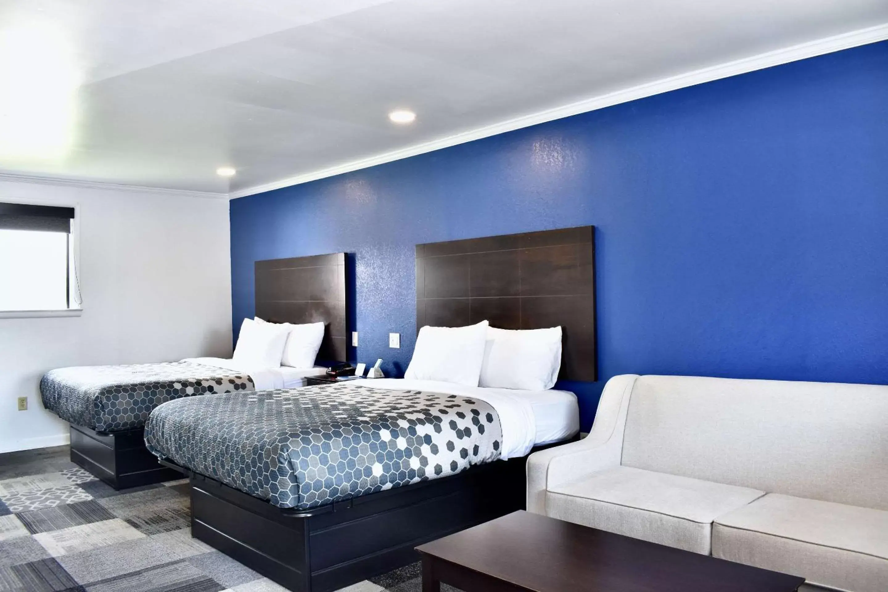 Queen Room with Two Queen Beds and Sofa Bed - Smoking in Rodeway Inn Queen Room with Two Queen Beds and Sofa Bed - Smoking in Rodeway Inn