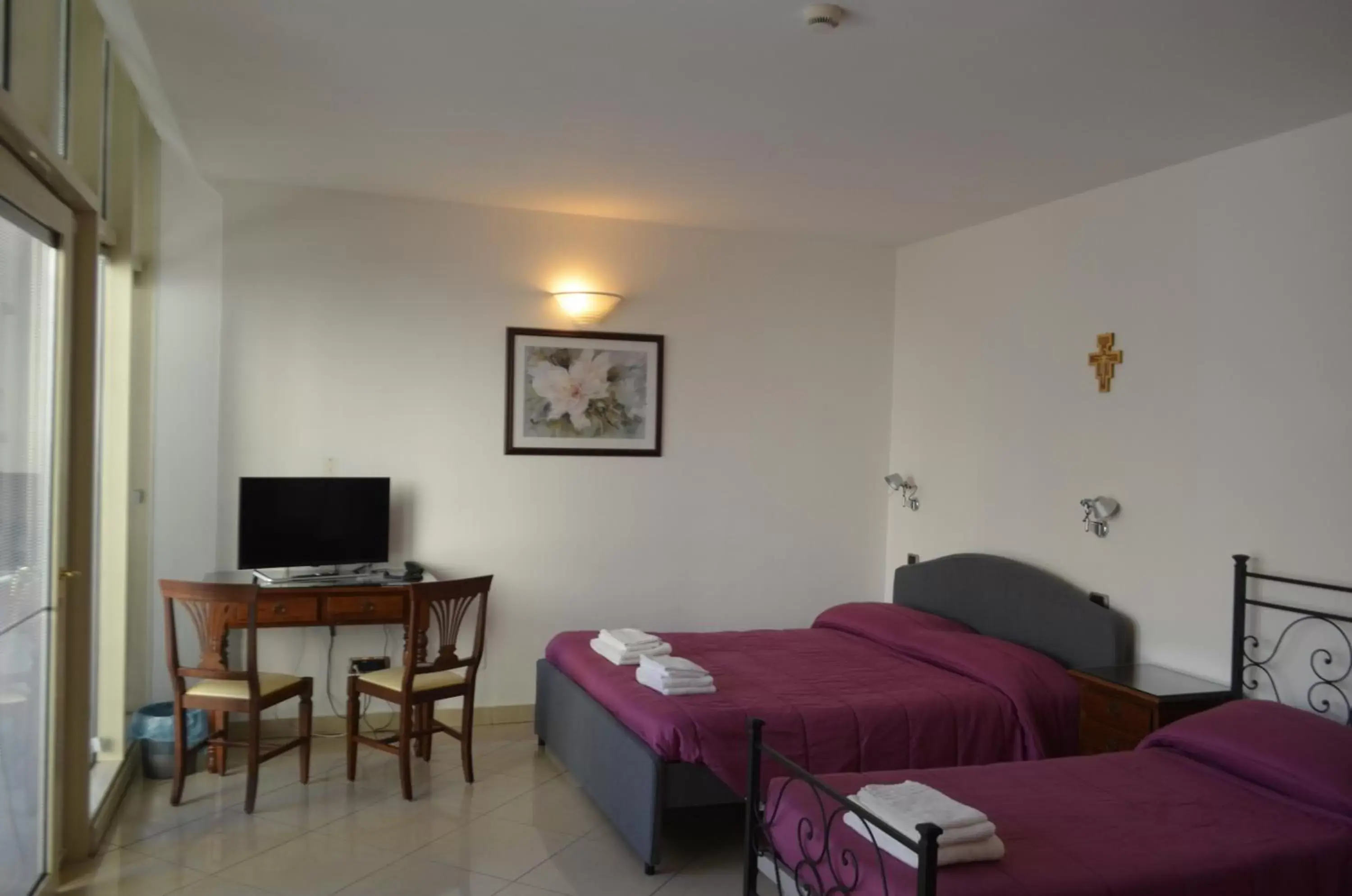 Quadruple Room with Private Bathroom in Casa per ferie religiosa Figlie di Nazareth Quadruple Room with Private Bathroom in Casa per ferie religiosa Figlie di Nazareth