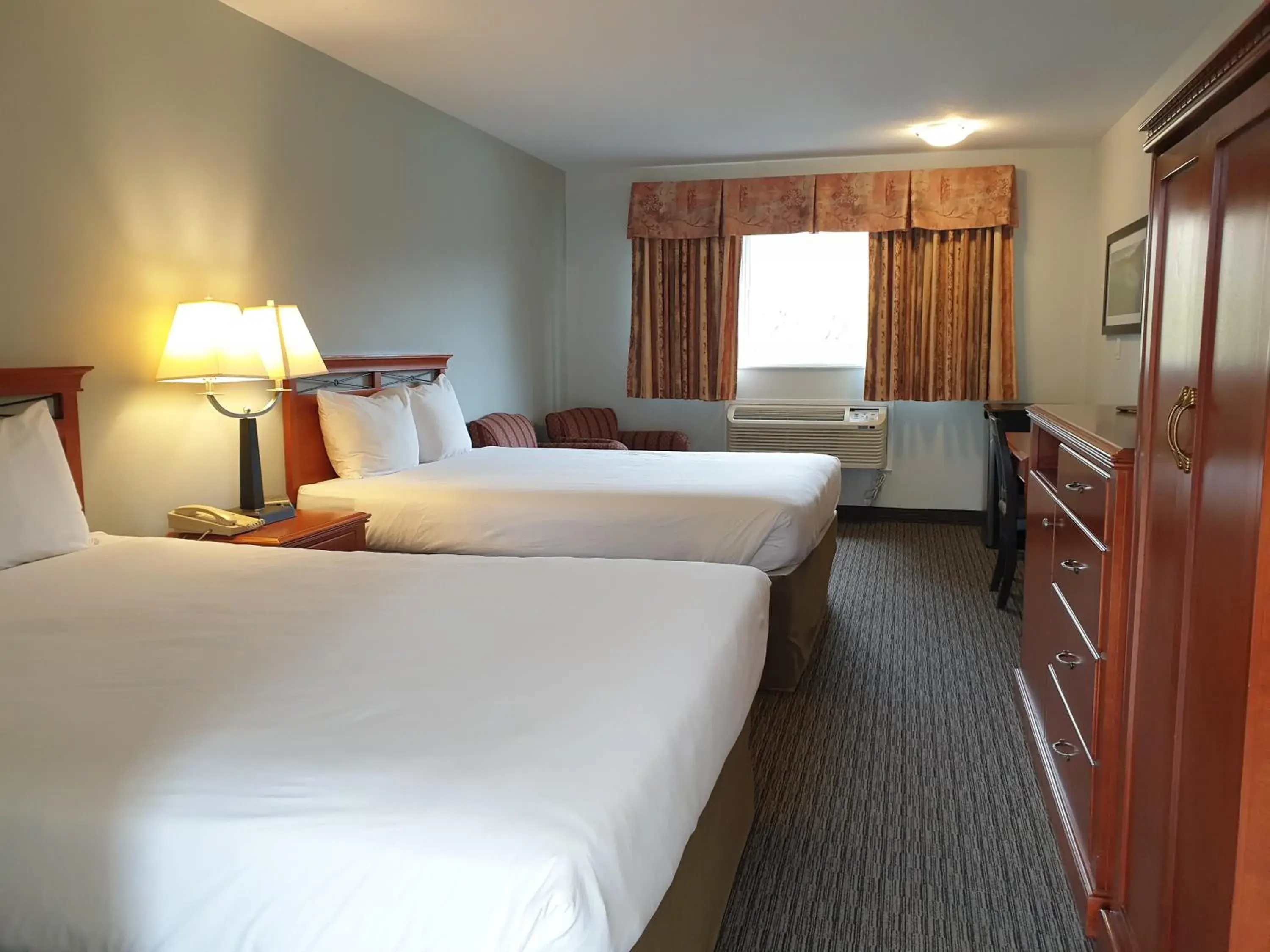 Queen Room with Two Queen Beds in Riverland Inn & Suites Queen Room with Two Queen Beds in Riverland Inn & Suites