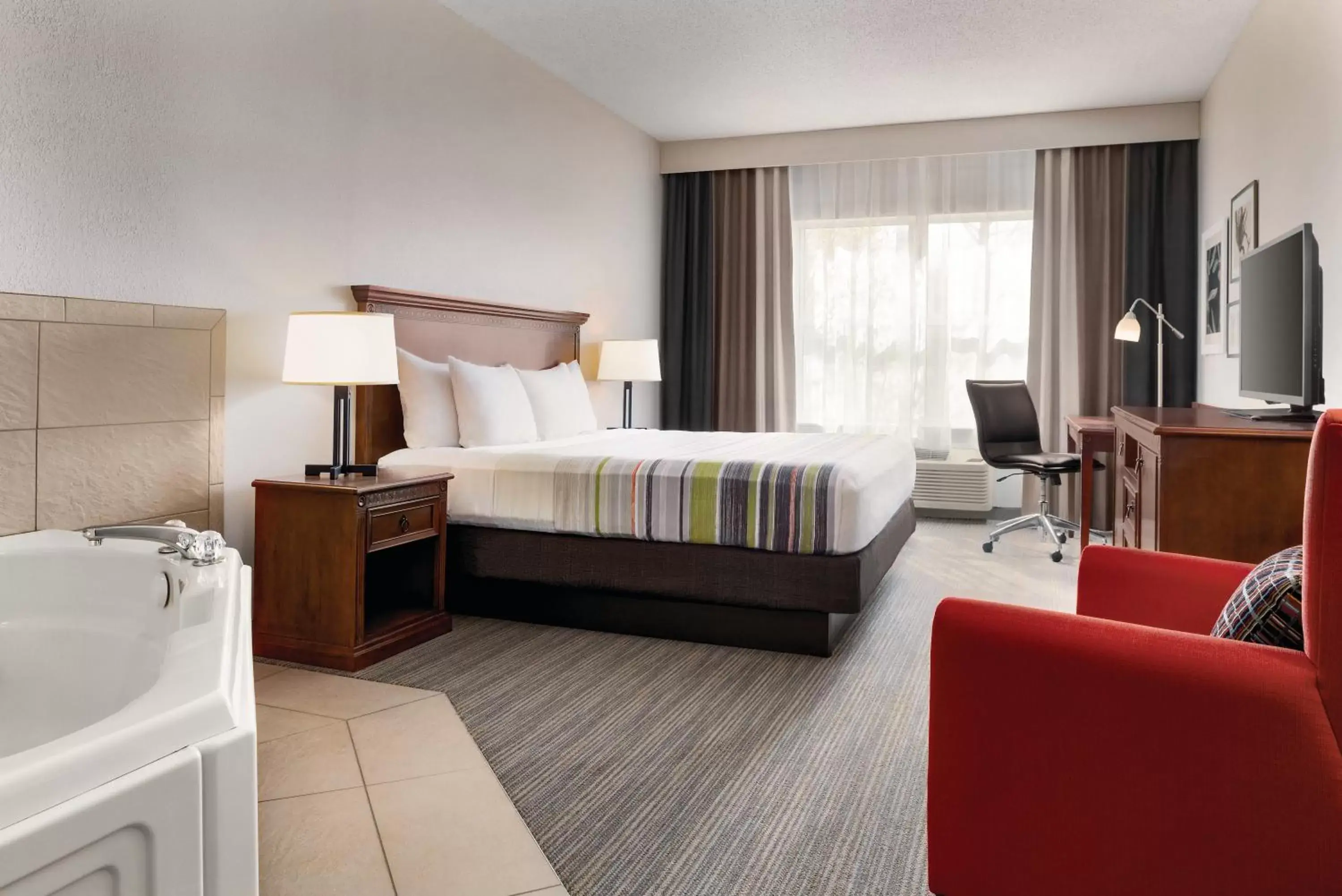 King Suite with Whirlpool and Roll-in Shower - Non-Smoking in Country Inn & Suites by Radisson, Marinette, WI King Suite with Whirlpool and Roll-in Shower - Non-Smoking in Country Inn & Suites by Radisson, Marinette, WI