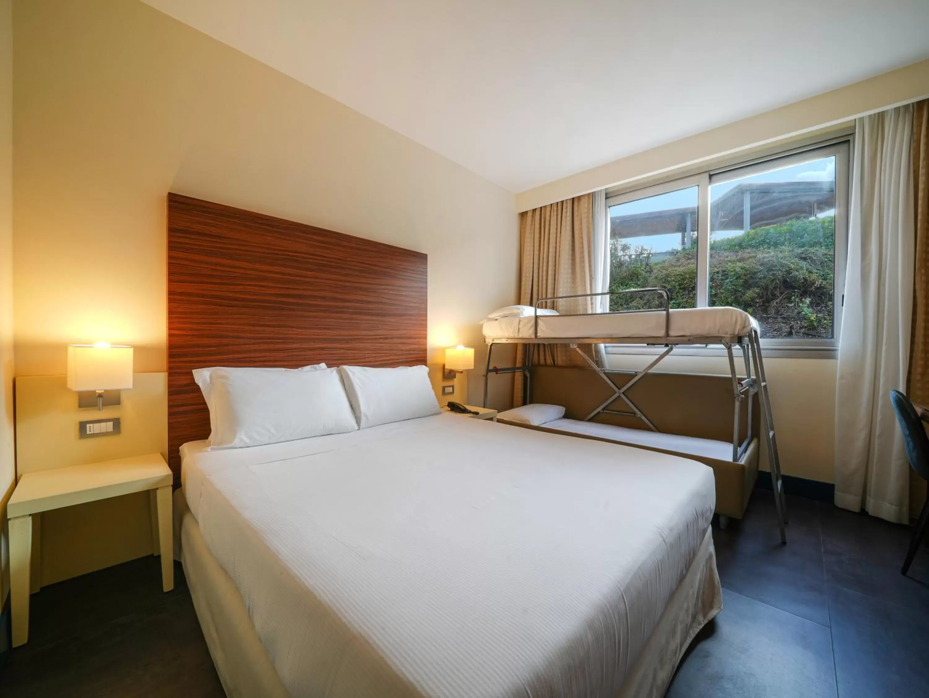 Family Room (2 Adults + 2 Children) in Hotel La Meridiana Family Room (2 Adults + 2 Children) in Hotel La Meridiana