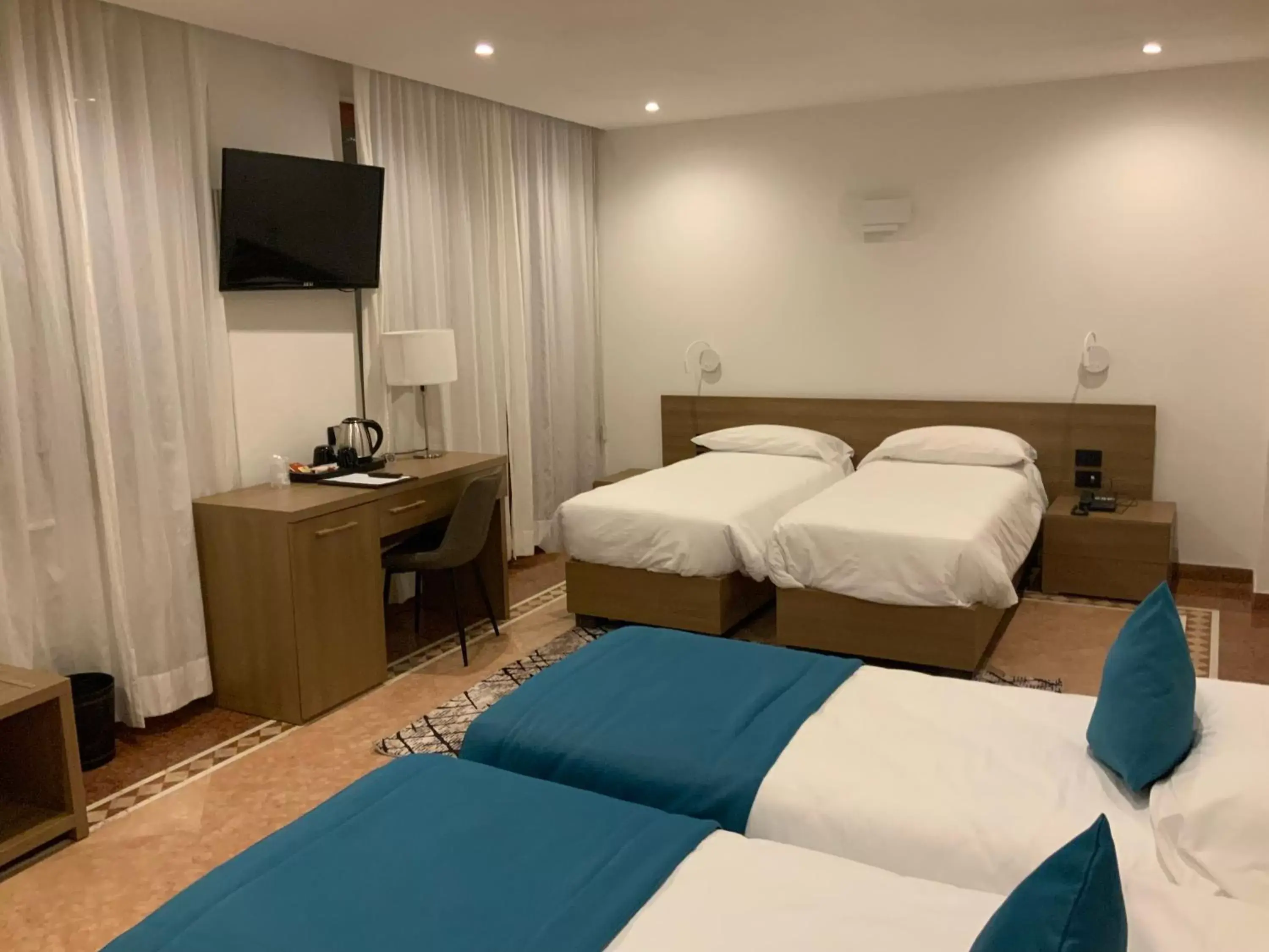 Standard Quadruple Room - single occupancy in Albergo Cappello e Cadore Standard Quadruple Room - single occupancy in Albergo Cappello e Cadore