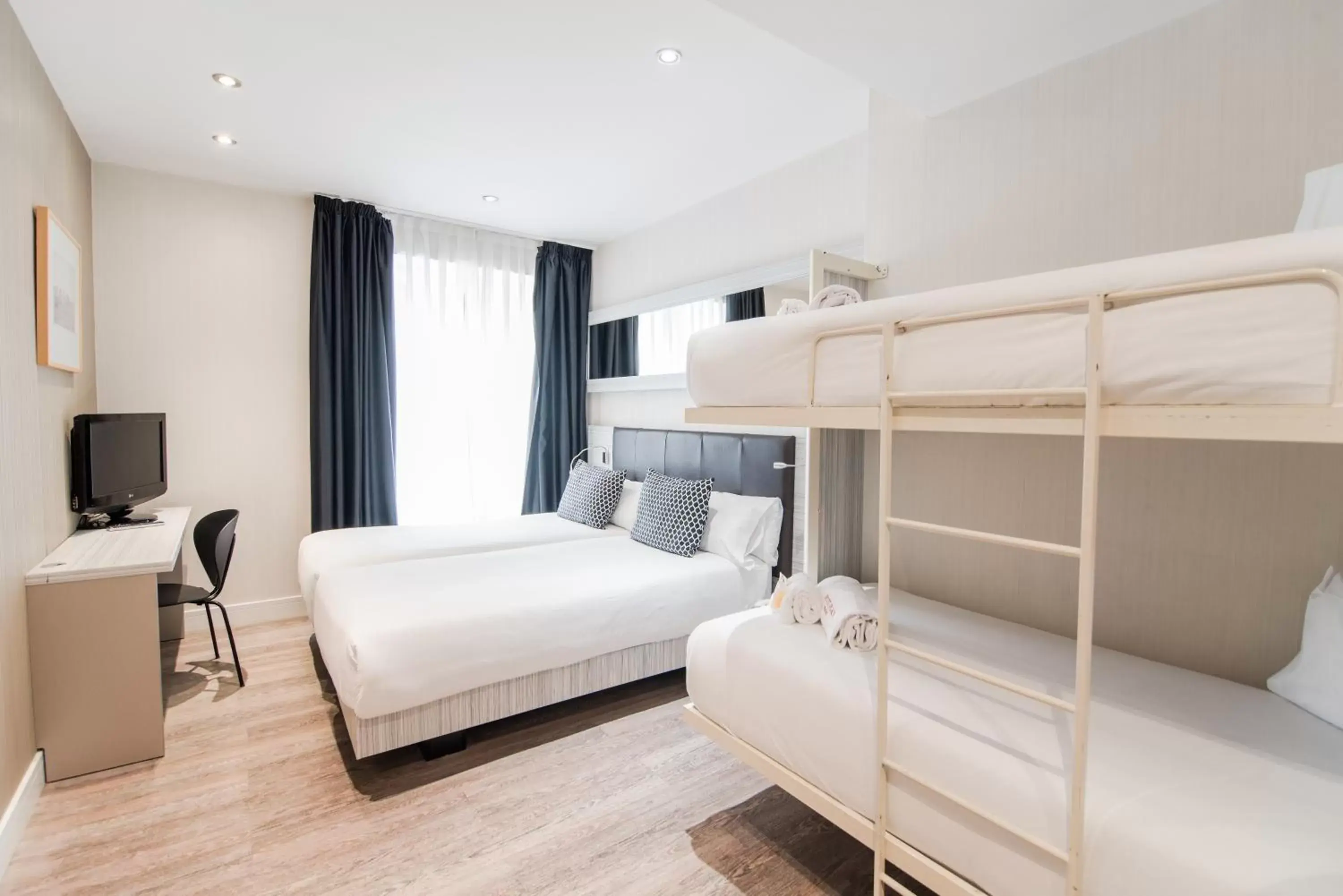 Quadruple Room (4 Adults) in Petit Palace Puerta del Sol Quadruple Room (4 Adults) in Petit Palace Puerta del Sol