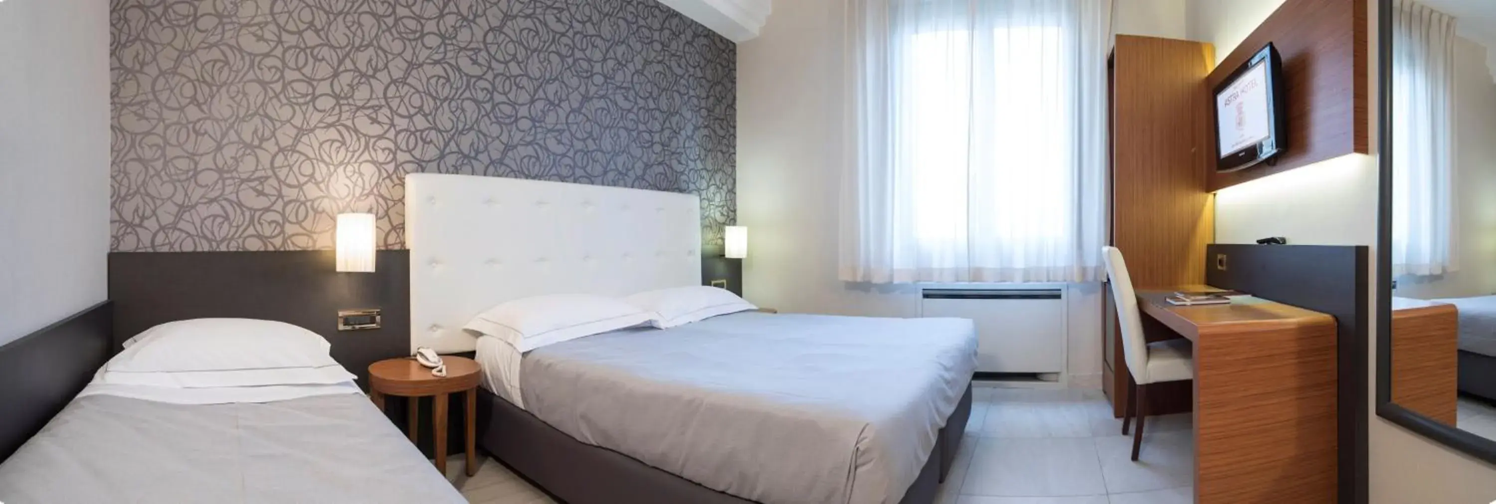 Standard Triple Room in Astra Hotel Standard Triple Room in Astra Hotel