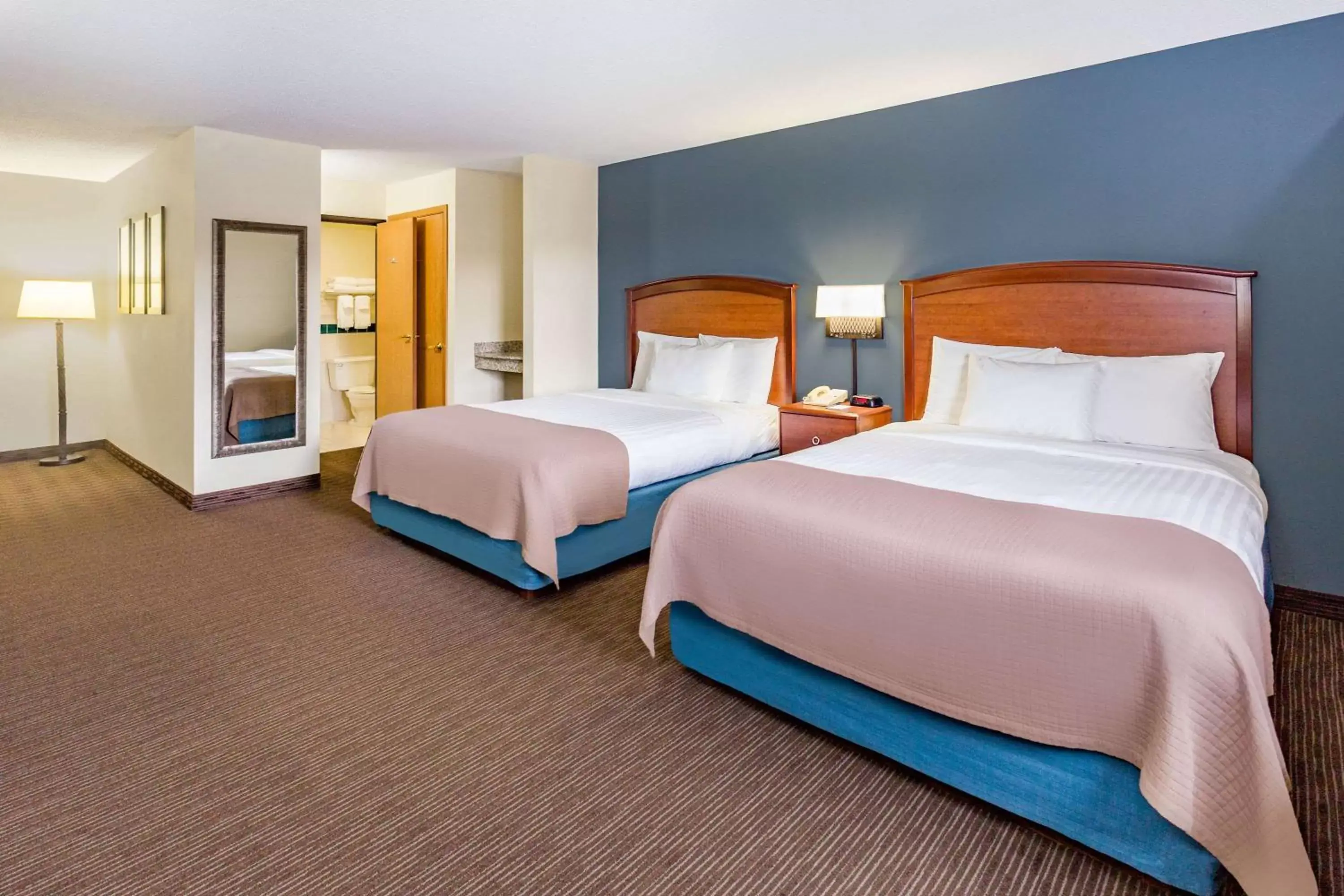 Deluxe Queen Room with Two Queen Beds - Non-Smoking in AmericInn by Wyndham Princeton MN Deluxe Queen Room with Two Queen Beds - Non-Smoking in AmericInn by Wyndham Princeton MN