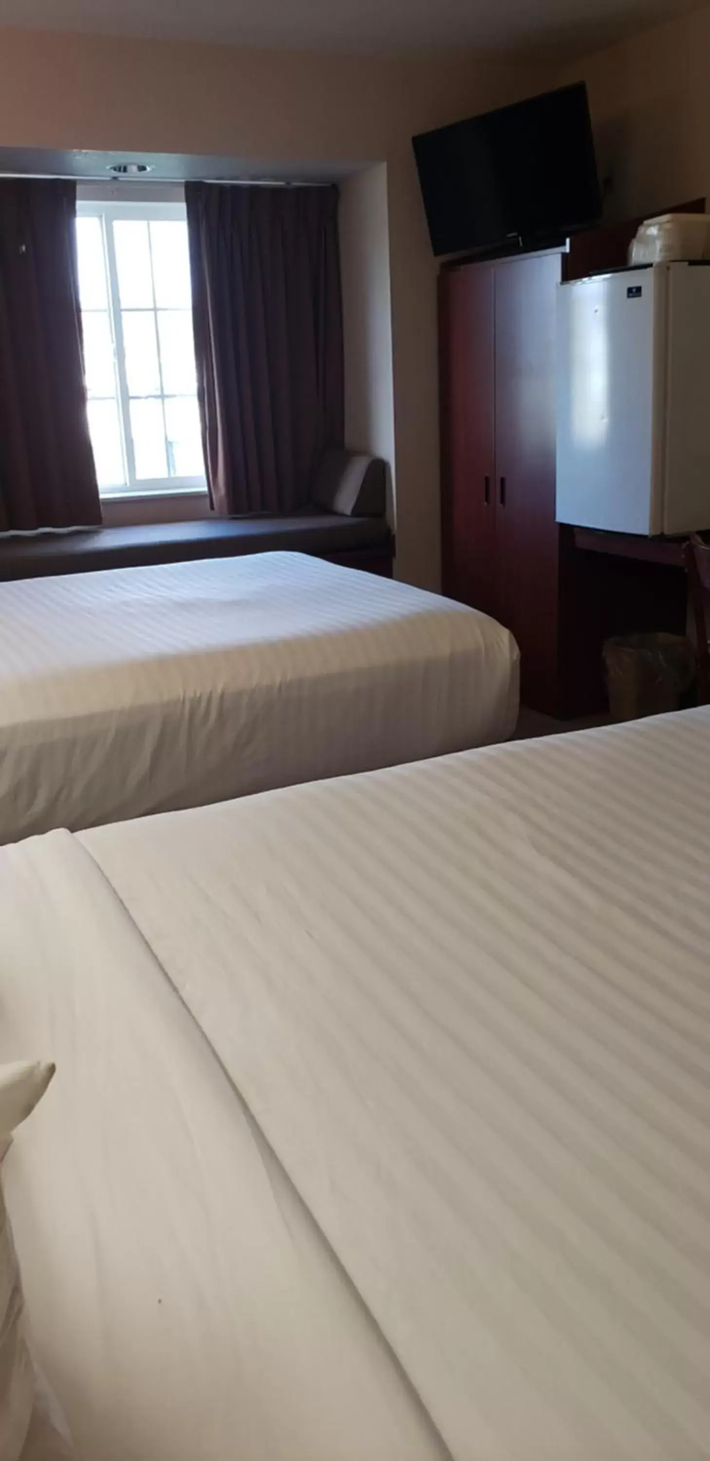 Queen Room with Two Queen Beds and Roll-In Shower - Mobility/Hearing Accessible - Non-Smoking in Microtel Inn & Suites by Wyndham Wellsville Queen Room with Two Queen Beds and Roll-In Shower - Mobility/Hearing Accessible - Non-Smoking in Microtel Inn & Suites by Wyndham Wellsville