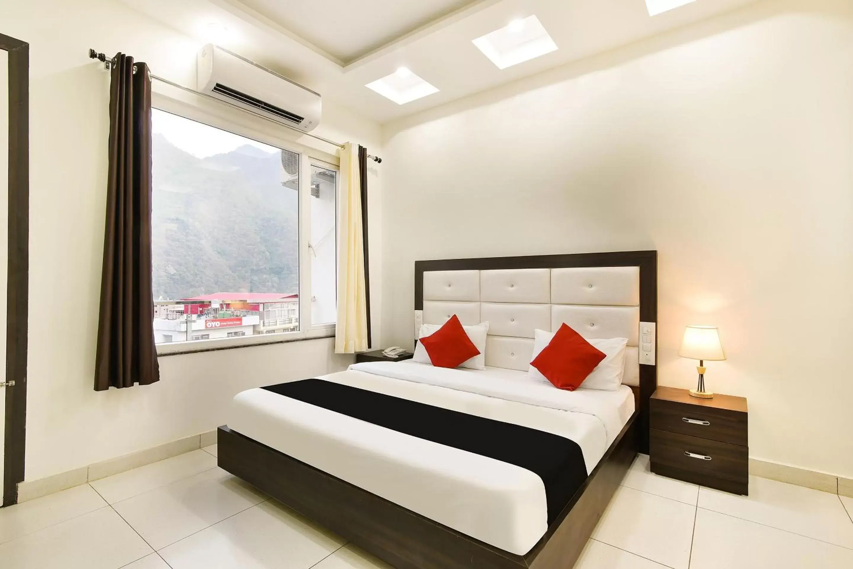 Deluxe Double Room with Balcony in Capital O Yogasthali Inn Hotel And Spa Deluxe Double Room with Balcony in Capital O Yogasthali Inn Hotel And Spa