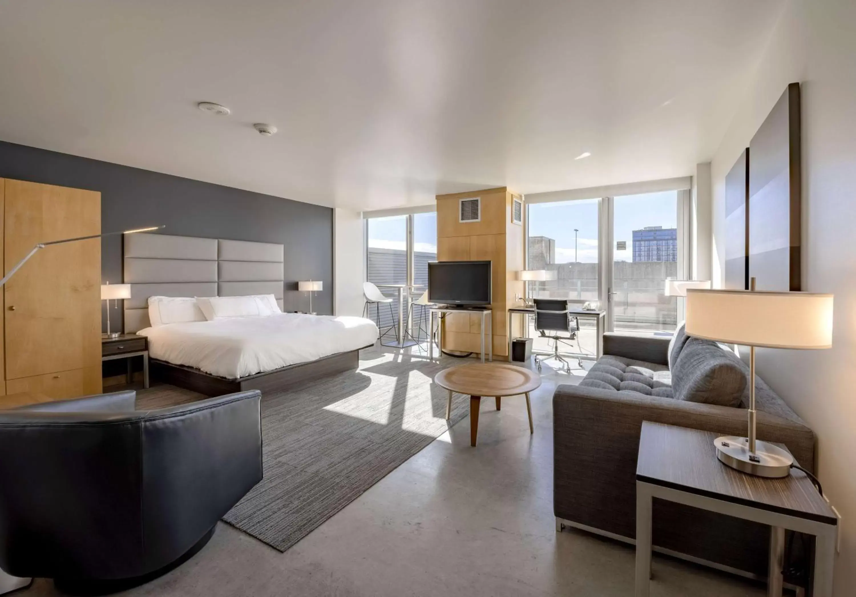 King Room with Kitchenette and Balcony in Hotelvetro Iowa City, Tapestry Collection By Hilton King Room with Kitchenette and Balcony in Hotelvetro Iowa City, Tapestry Collection By Hilton