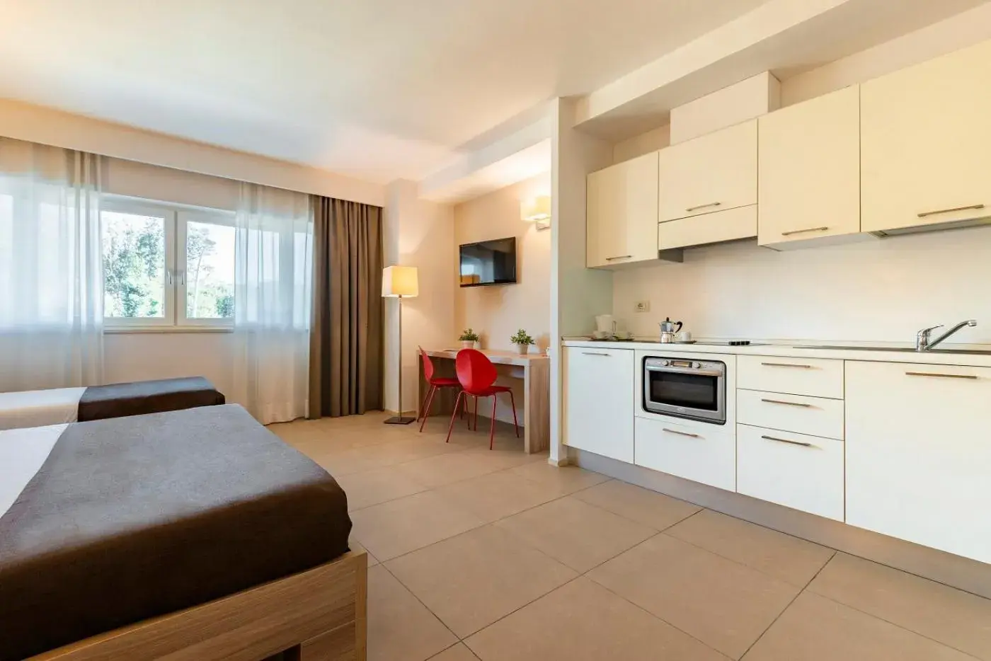 Triple Room with Kitchenette in Hotel Dimorae Rooms and Suites - Apartments Triple Room with Kitchenette in Hotel Dimorae Rooms and Suites - Apartments