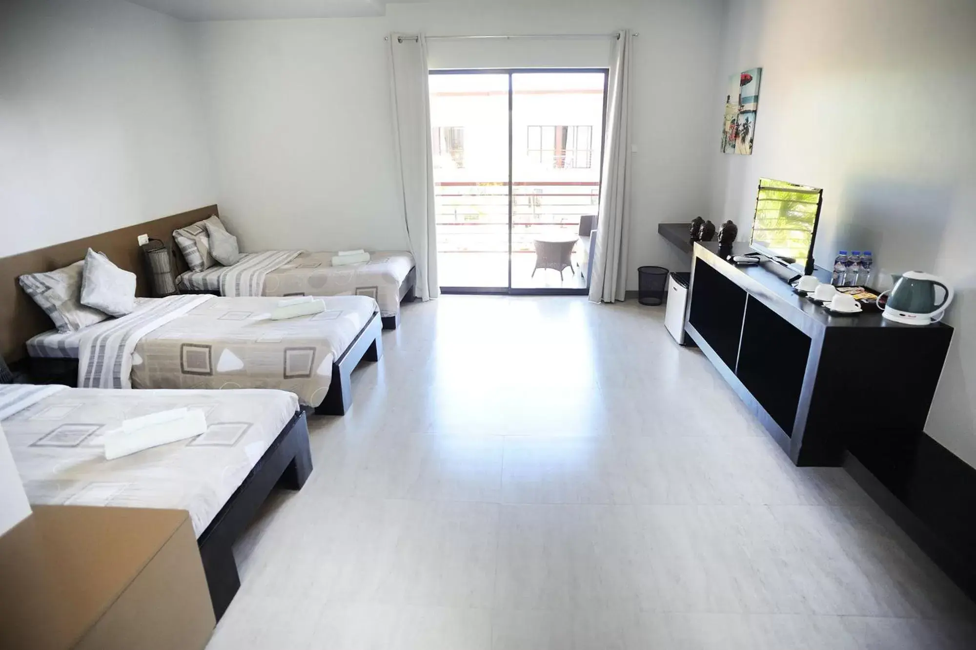 Triple deluxe with pool view in Tamarind Triple deluxe with pool view in Tamarind