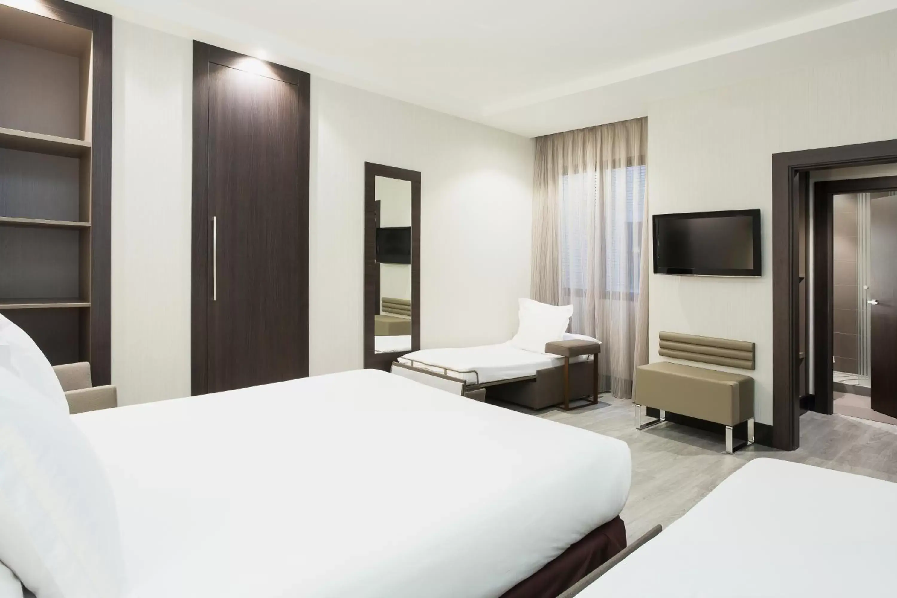 Standard Room with One Queen Bed and Two Single Beds in Novotel Madrid Center Standard Room with One Queen Bed and Two Single Beds in Novotel Madrid Center