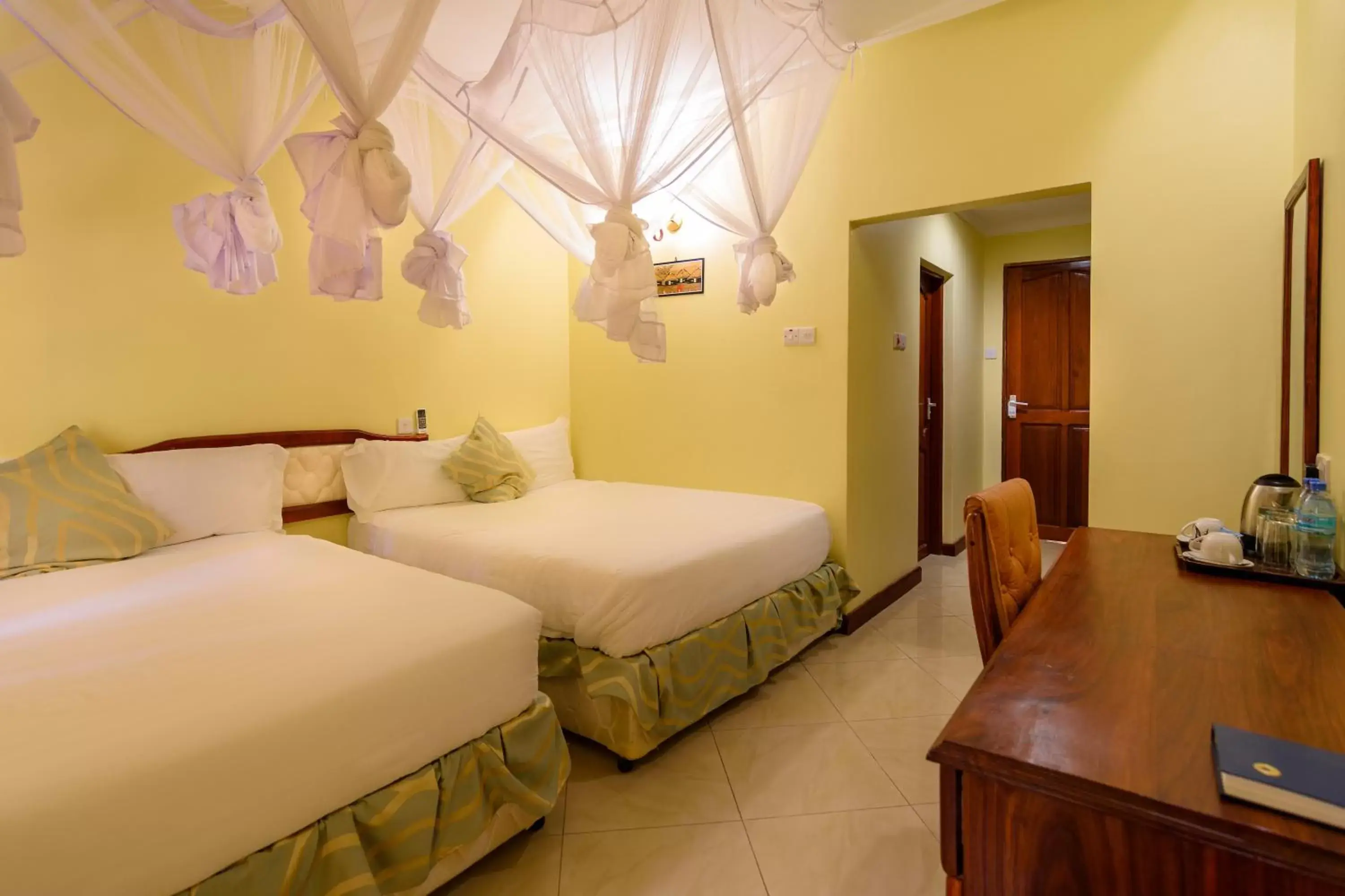 Twin Room with Balcony in Mvuli Hotels Arusha Twin Room with Balcony in Mvuli Hotels Arusha