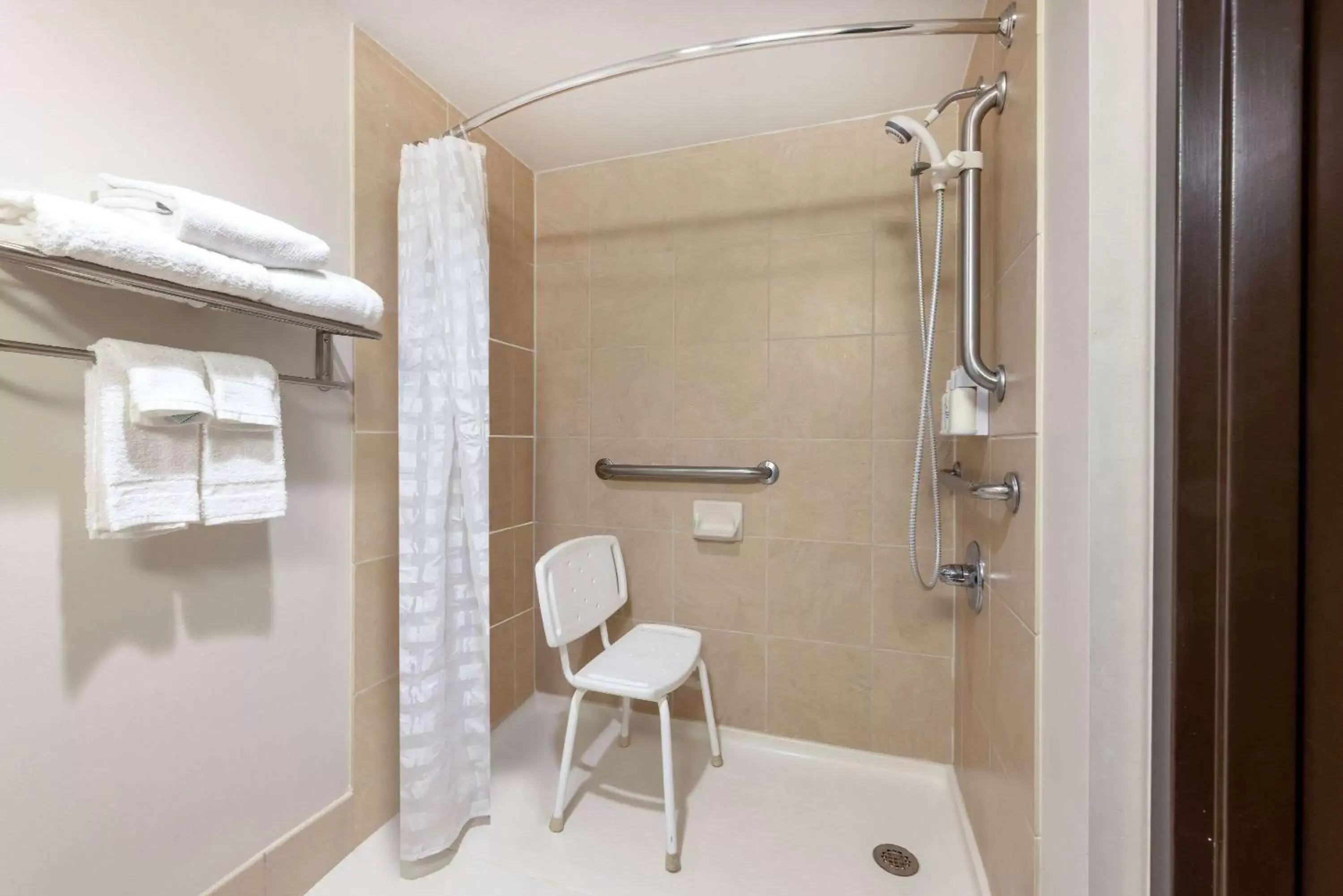 Accessible King Junior Suite with Roll-In Shower - Non-Smoking in Wyndham Garden Kansas City Airport Accessible King Junior Suite with Roll-In Shower - Non-Smoking in Wyndham Garden Kansas City Airport