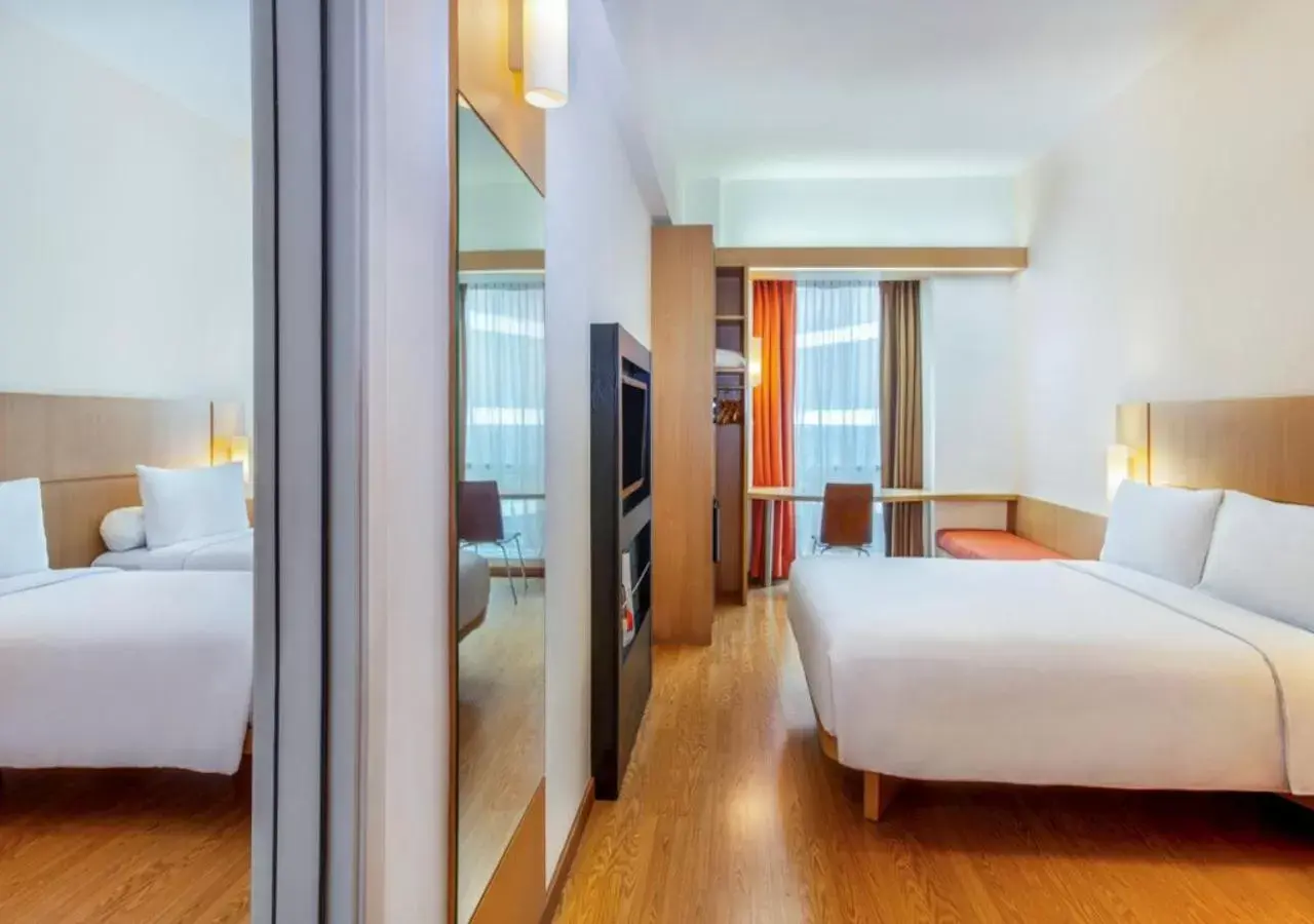 Family Room with Queen Bed and Two Single Beds in Ibis Bandung Trans Studio Family Room with Queen Bed and Two Single Beds in Ibis Bandung Trans Studio