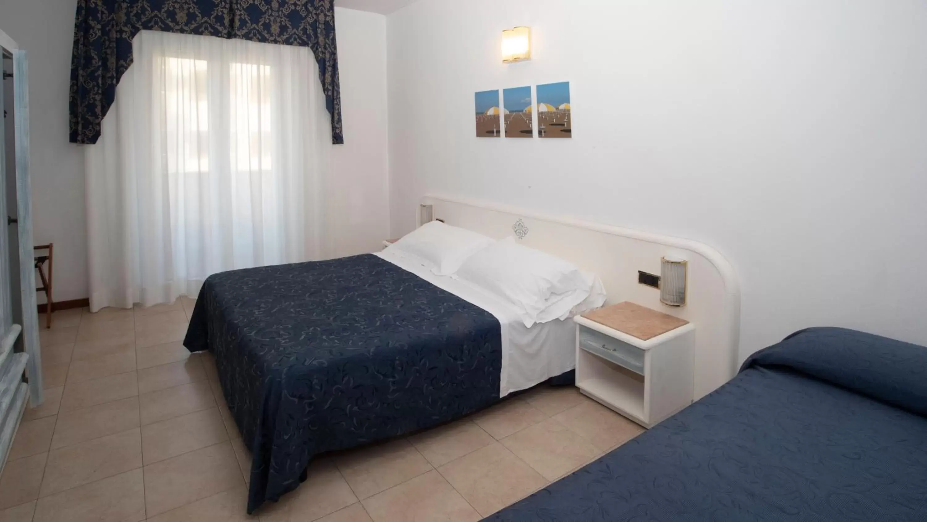 Triple Room with Side Sea View in Hotel Du Soleil Triple Room with Side Sea View in Hotel Du Soleil