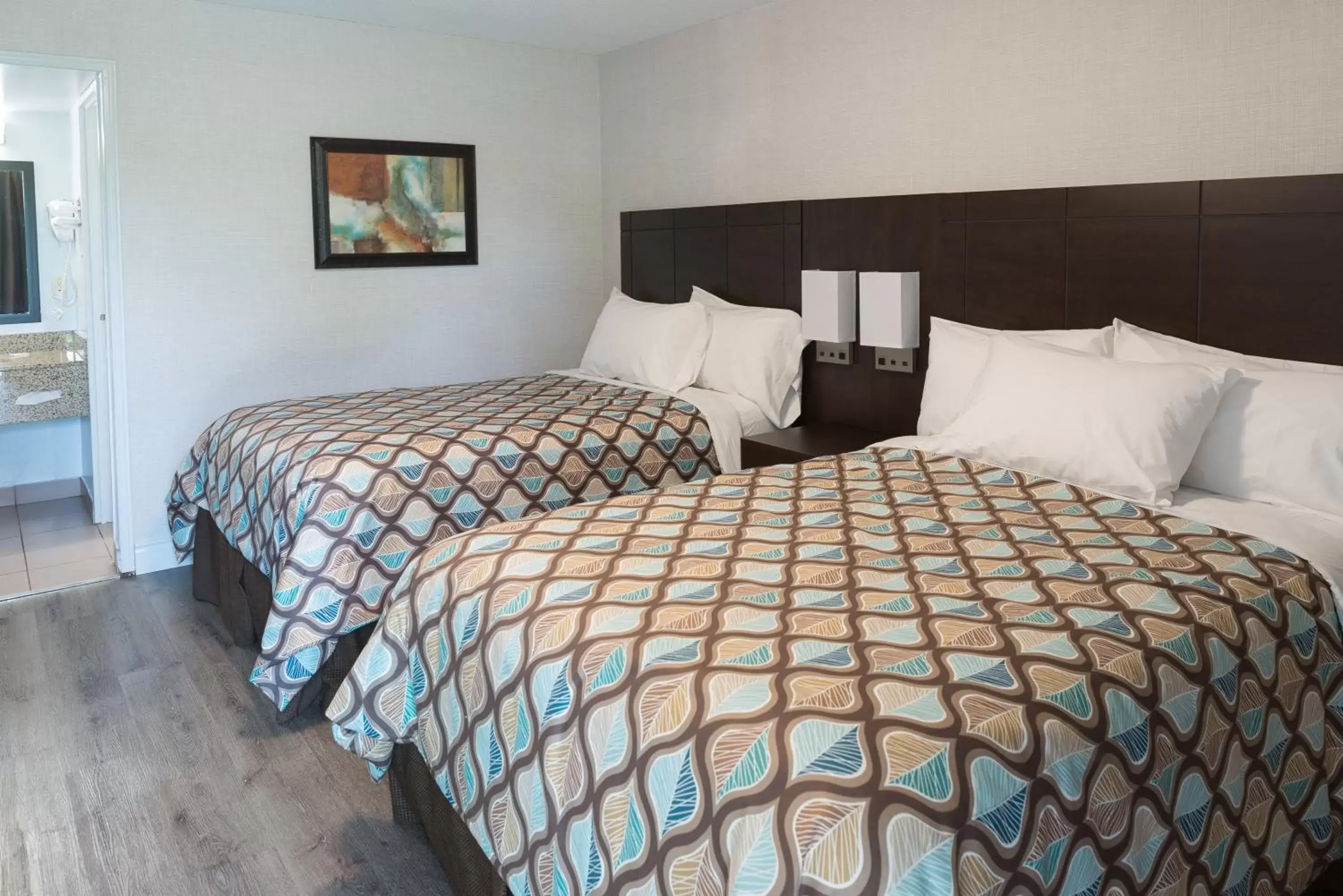 Queen Room with Two Queen Beds - Non-Smoking in Deluxe Inn Queen Room with Two Queen Beds - Non-Smoking in Deluxe Inn