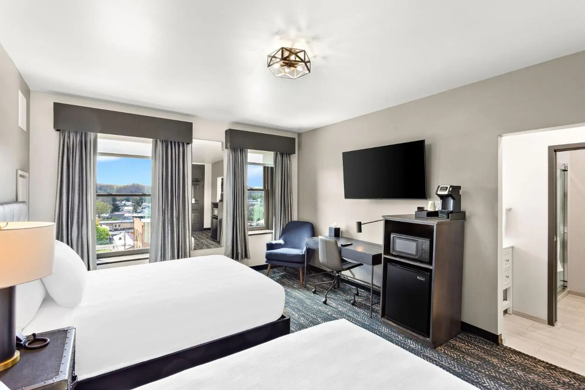 Quadruple Room with Two Queen Beds - Non Smoking/Interior Hall in Tygart Hotel, an Ascend Collection Hotel Quadruple Room with Two Queen Beds - Non Smoking/Interior Hall in Tygart Hotel, an Ascend Collection Hotel