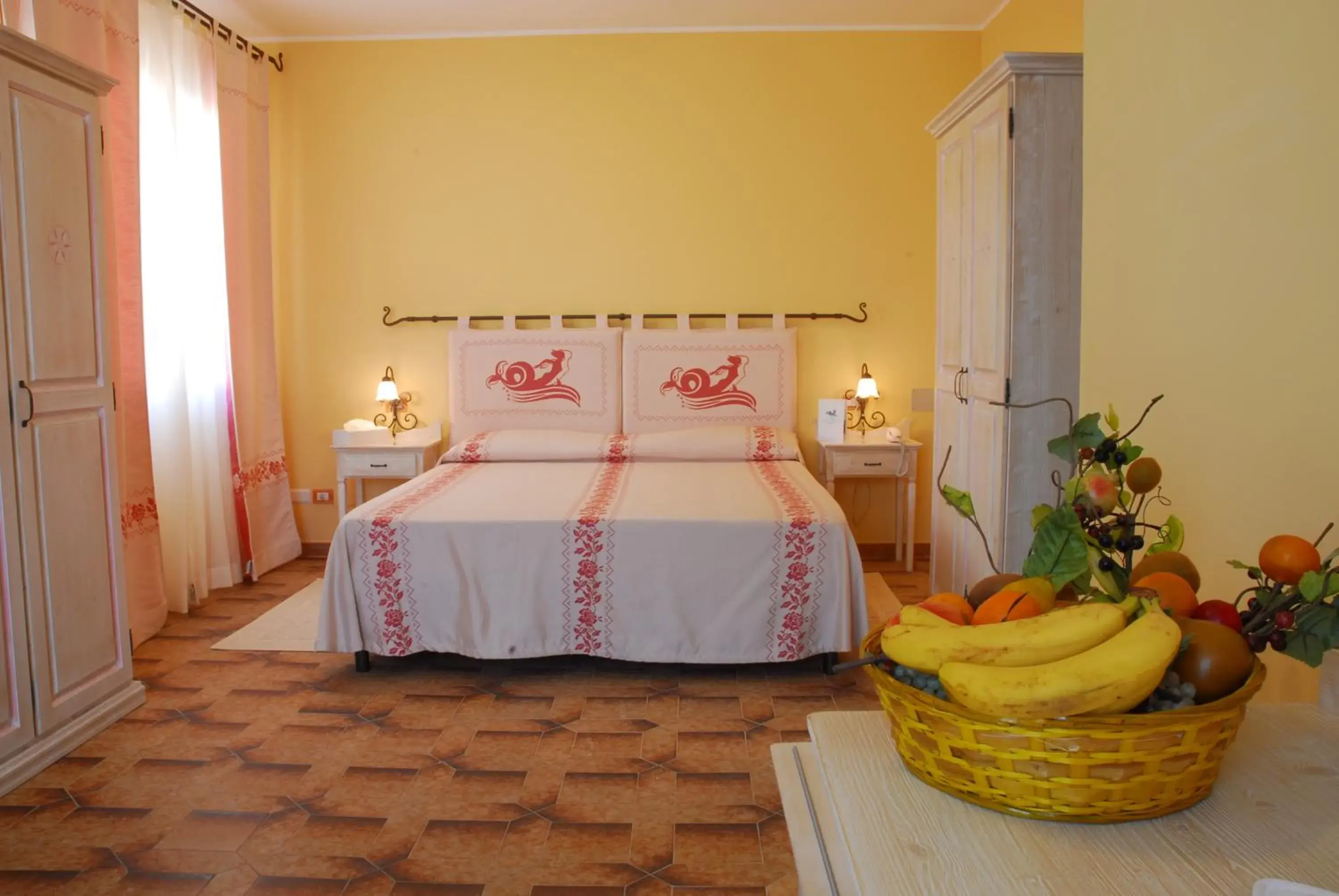 Comfort Quadruple Room in LE NEREIDI Hotel & Residence Comfort Quadruple Room in LE NEREIDI Hotel & Residence