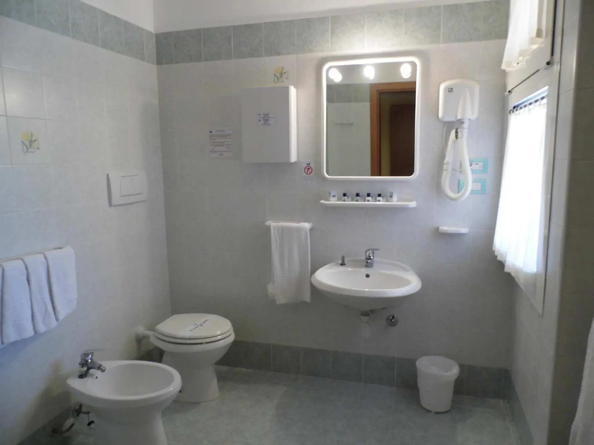 Triple Room in LE NEREIDI Hotel & Residence Triple Room in LE NEREIDI Hotel & Residence