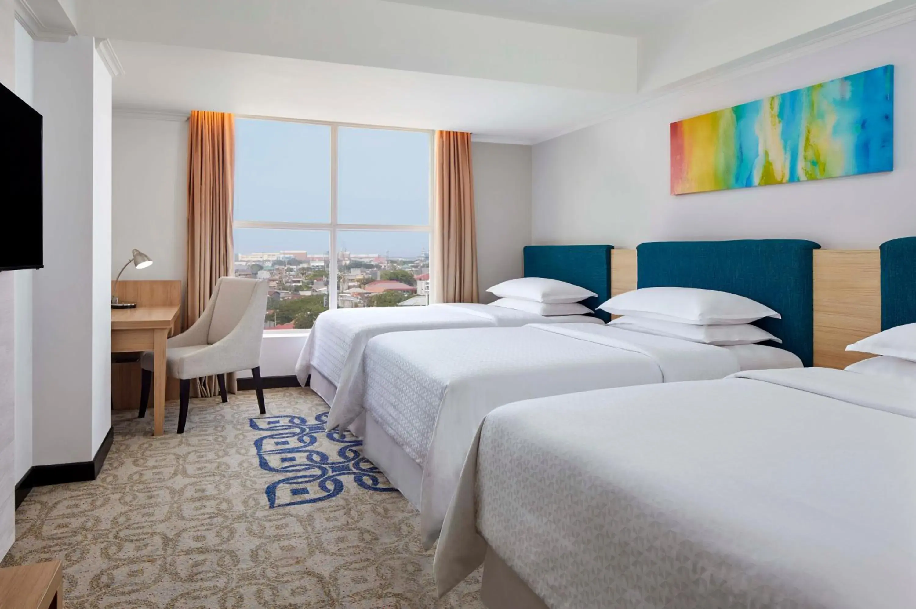 Deluxe Triple Room in Four Points by Sheraton Makassar Deluxe Triple Room in Four Points by Sheraton Makassar