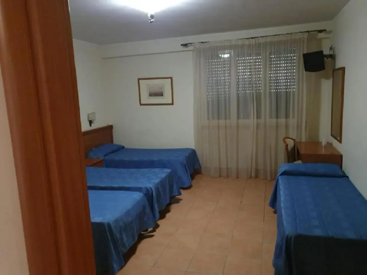 Quadruple Room in Park Hotel Villamaria Quadruple Room in Park Hotel Villamaria