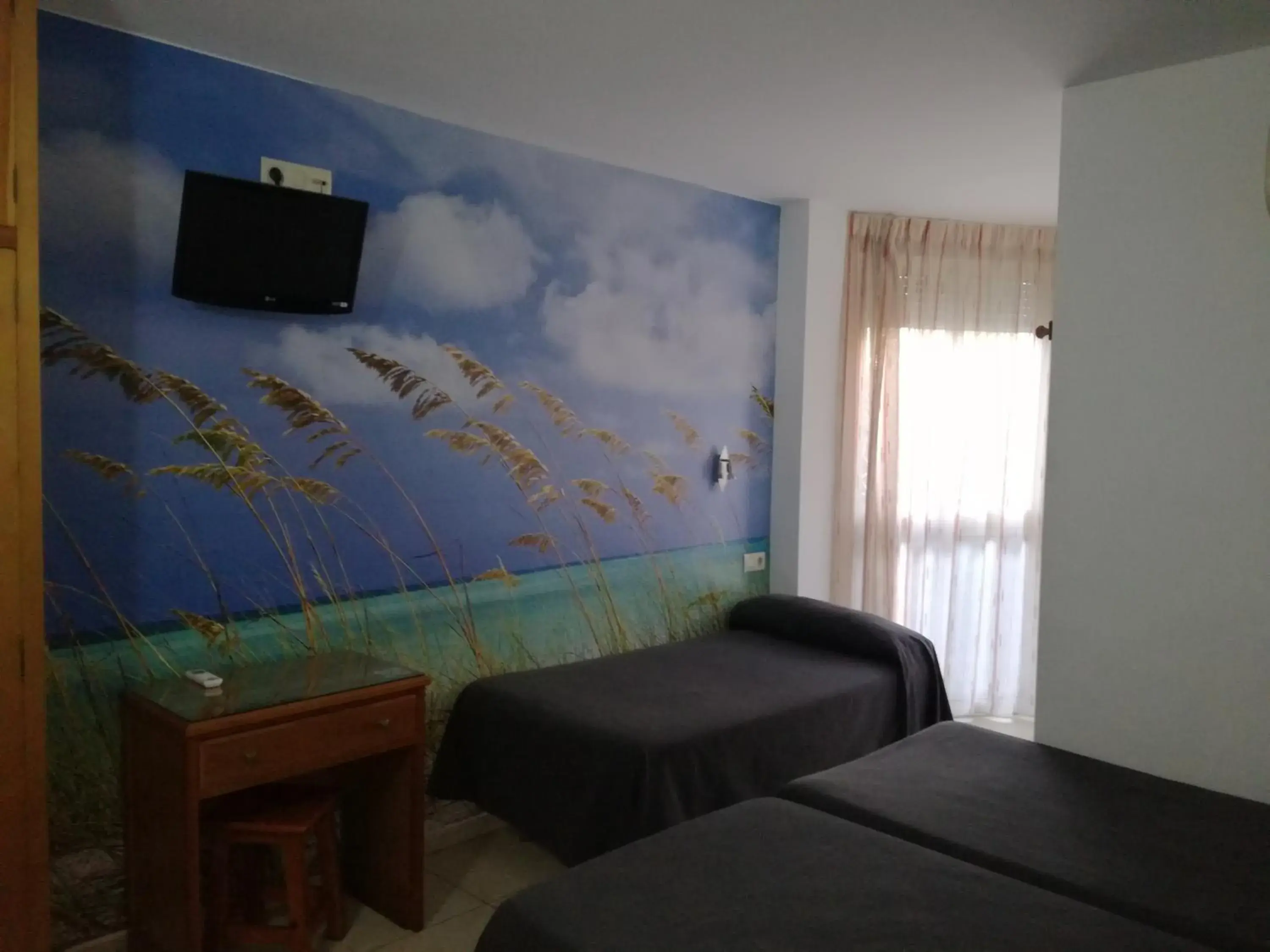 Triple Room in Hostal Maribel Triple Room in Hostal Maribel