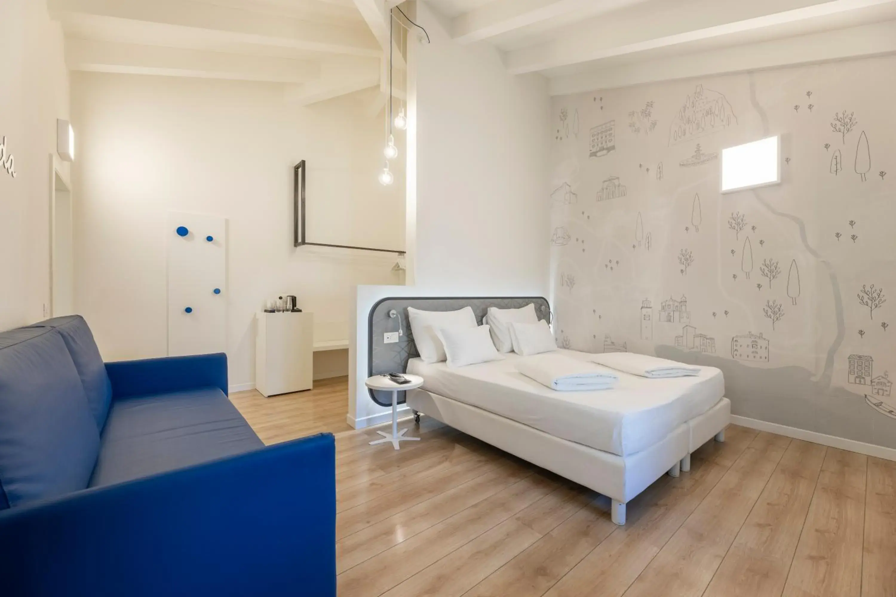 Quadruple Room with Garden View in SeeLE Garda Hotel Quadruple Room with Garden View in SeeLE Garda Hotel