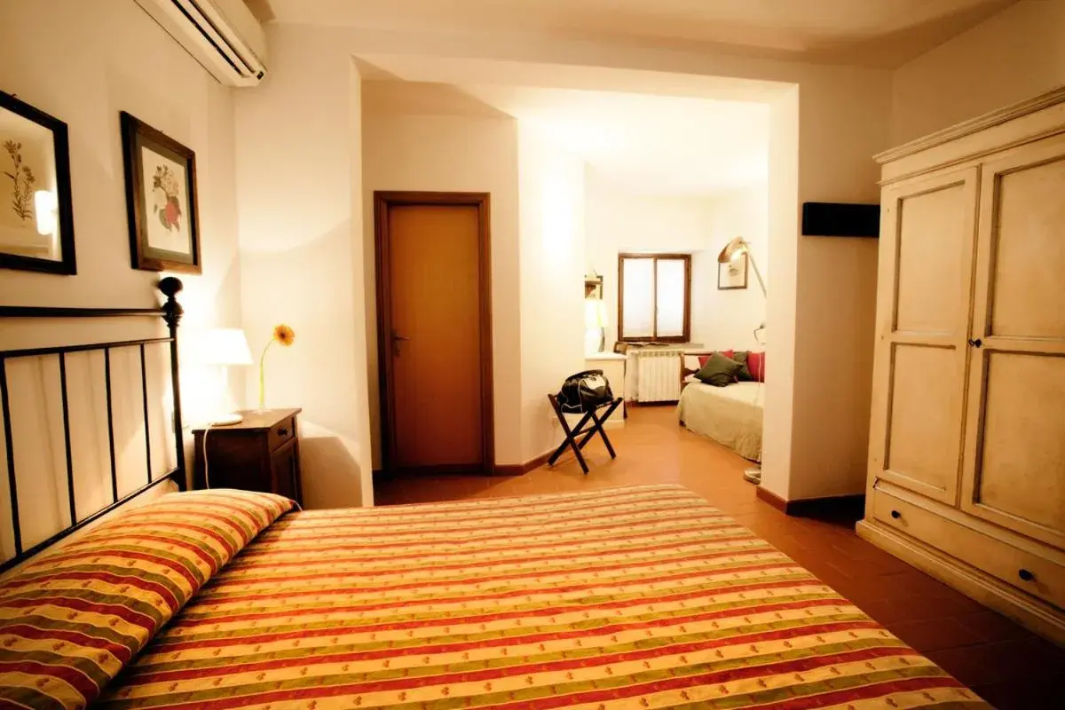 Classic Triple Room in Antico Casale Di Scansano Resort Classic Triple Room in Antico Casale Di Scansano Resort