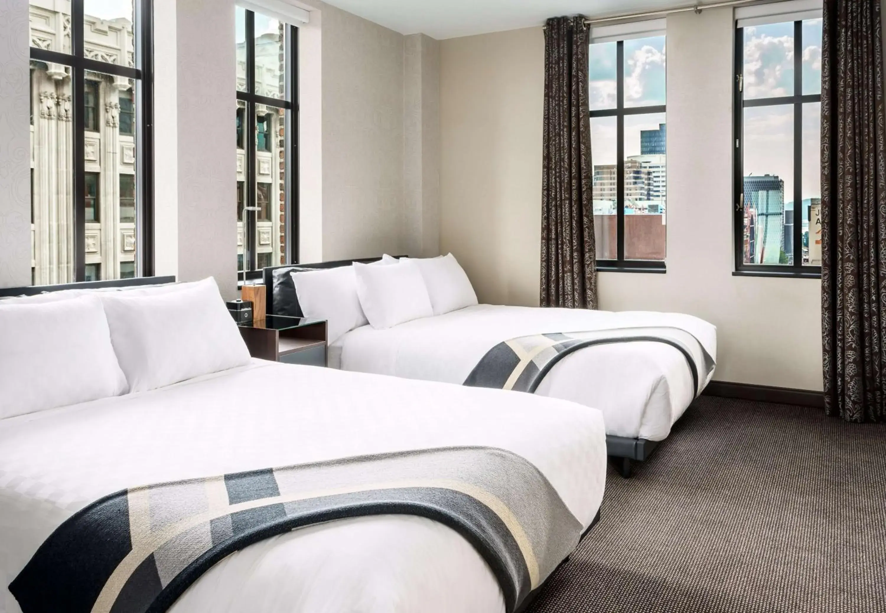 Deluxe Queen Room with Two Queen Beds and Roll-In Shower - Mobility Access in Joinery Hotel Pittsburgh, Curio Collection by Hilton Deluxe Queen Room with Two Queen Beds and Roll-In Shower - Mobility Access in Joinery Hotel Pittsburgh, Curio Collection by Hilton