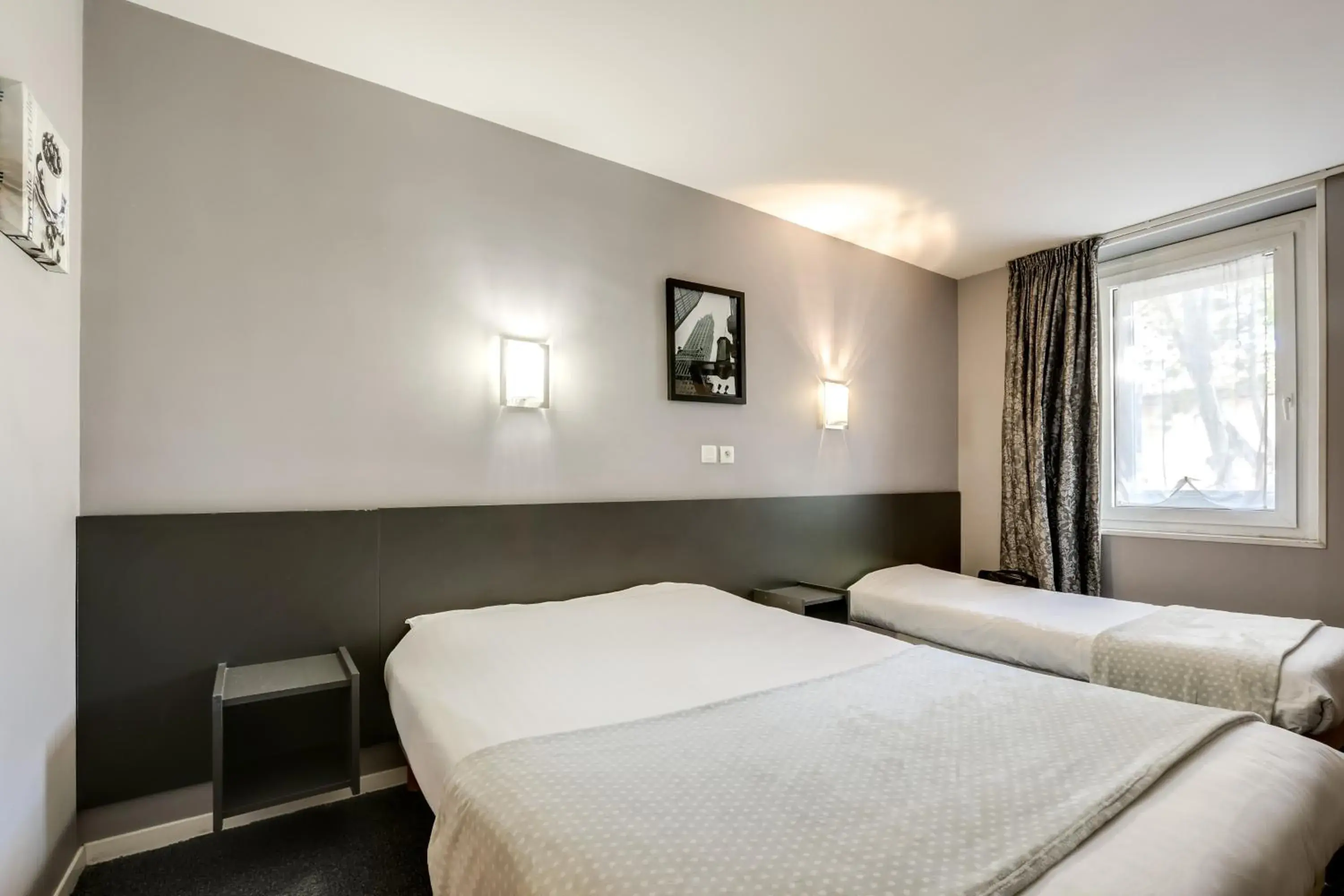 Triple Room (1 Double Bed + 1 Single Bed) in Hôtel Du Midi Triple Room (1 Double Bed + 1 Single Bed) in Hôtel Du Midi