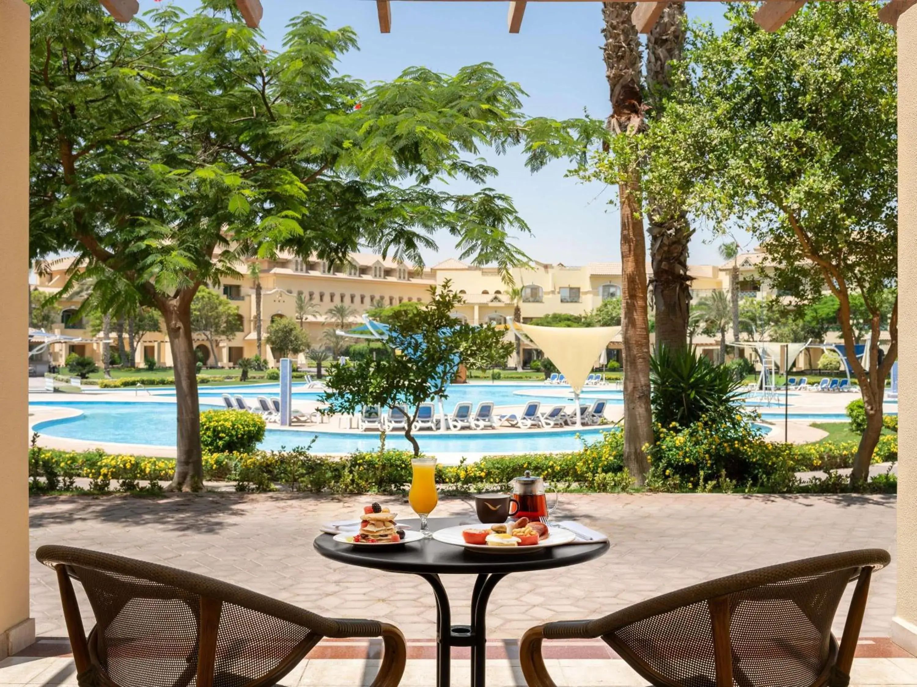 Deluxe Twin Room With Garden and Pool View in Mövenpick Hotel Cairo - Media City Deluxe Twin Room With Garden and Pool View in Mövenpick Hotel Cairo - Media City