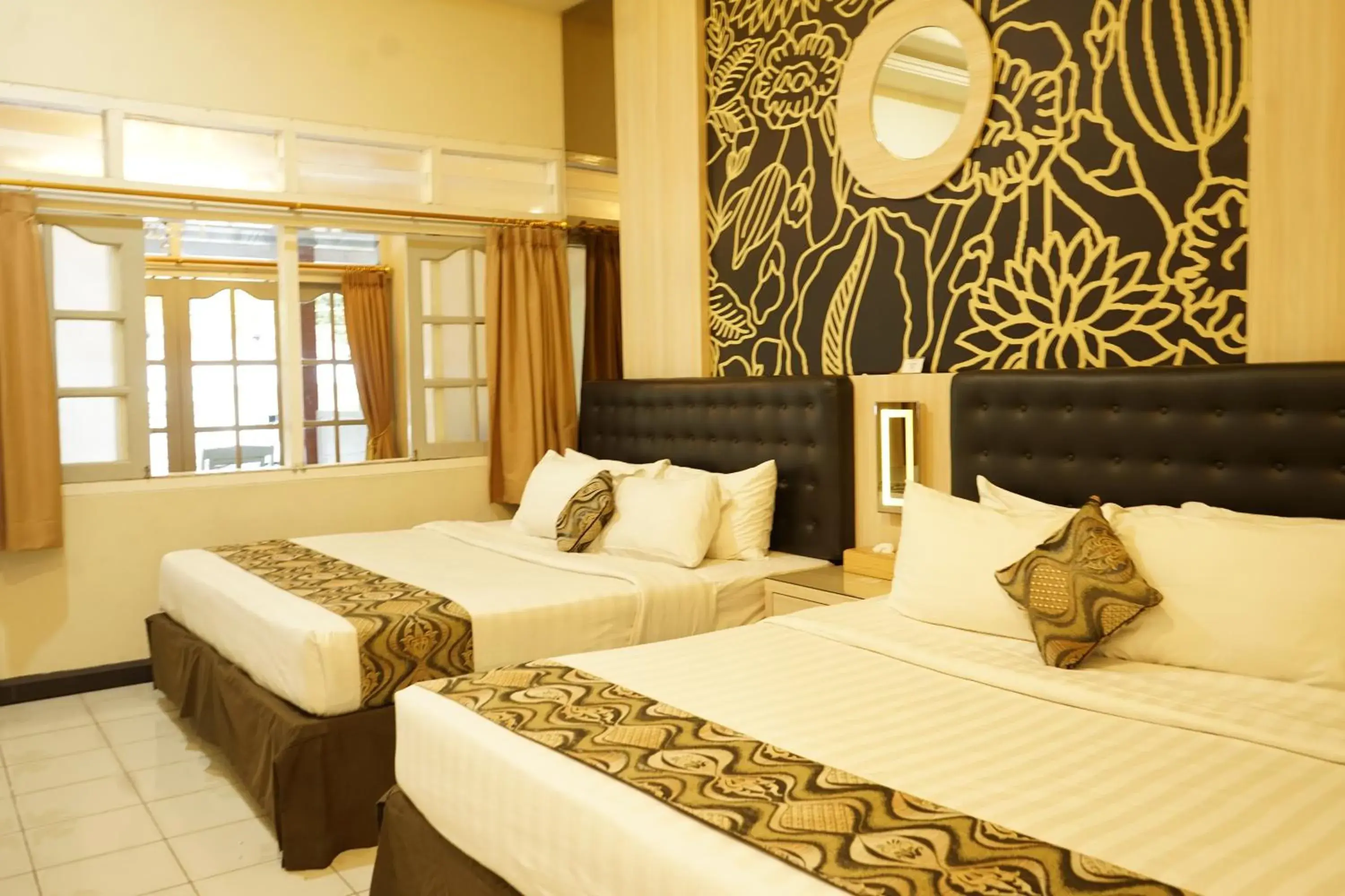 Deluxe Double or Twin Room with Garden View in Hotel Indah Palace Tawangmangu Deluxe Double or Twin Room with Garden View in Hotel Indah Palace Tawangmangu