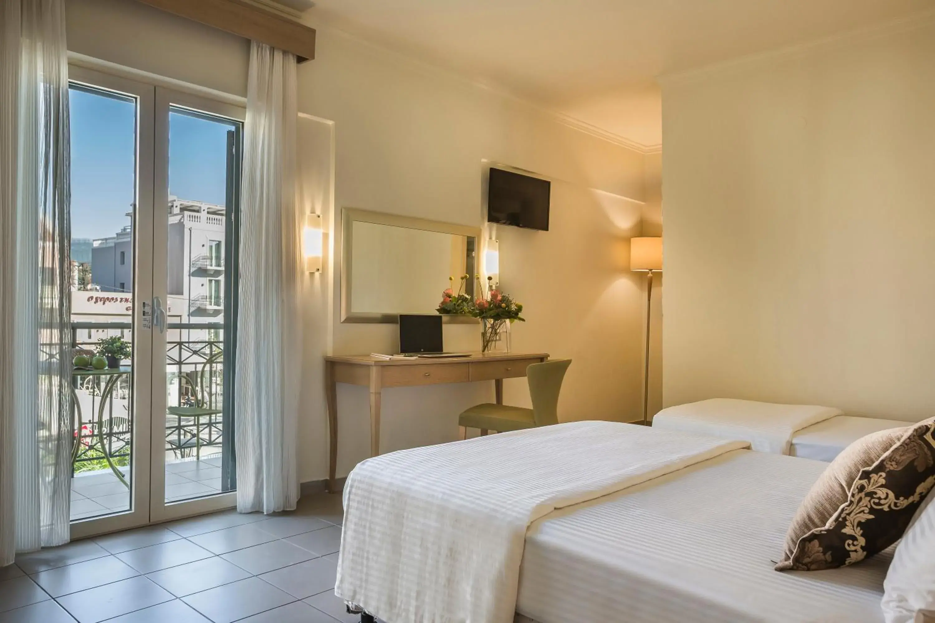Classic Triple Room with Balcony in Ionian Plaza Hotel & Spa Classic Triple Room with Balcony in Ionian Plaza Hotel & Spa
